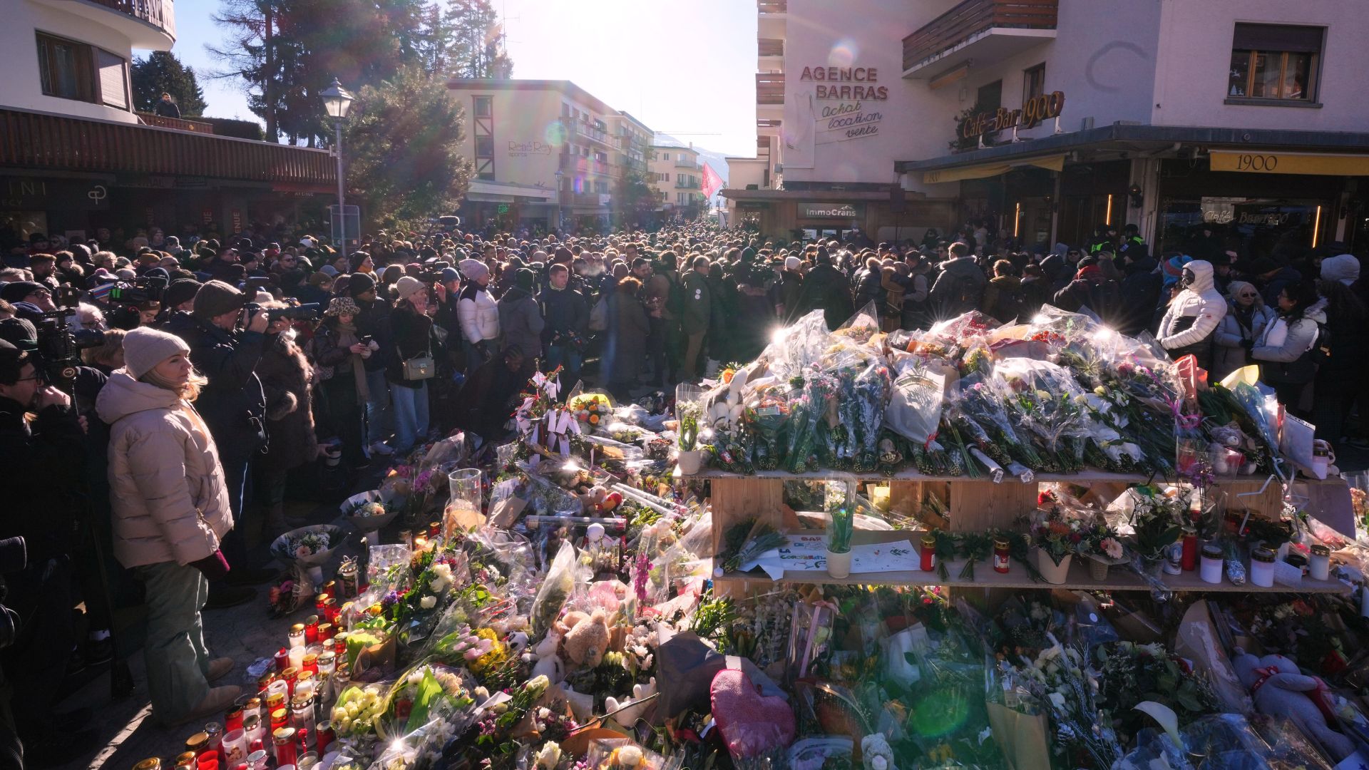 People gather during a memorial procession in Crans-Montana, Swiss Alps, Switzerland, Jan. 4, 2026, after a fire in Le Constellation bar during the New Year's celebrations.