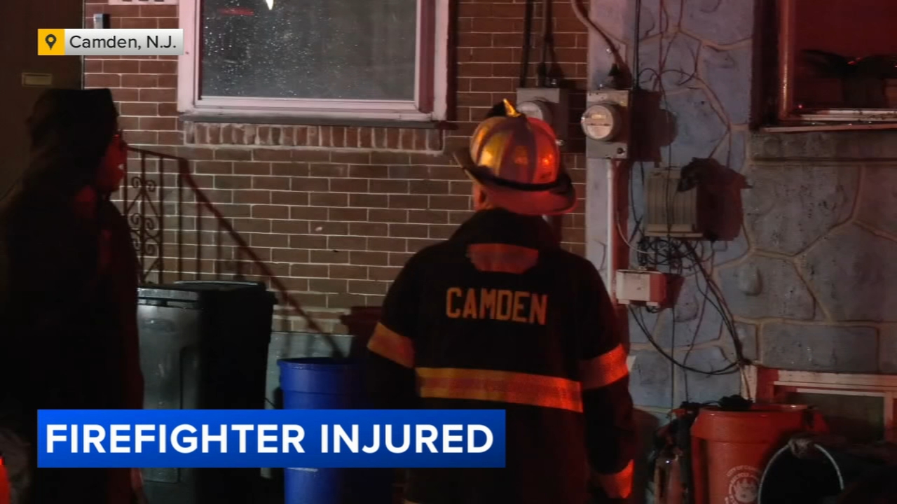 Firefighter injured while battling blaze inside row home in Camden