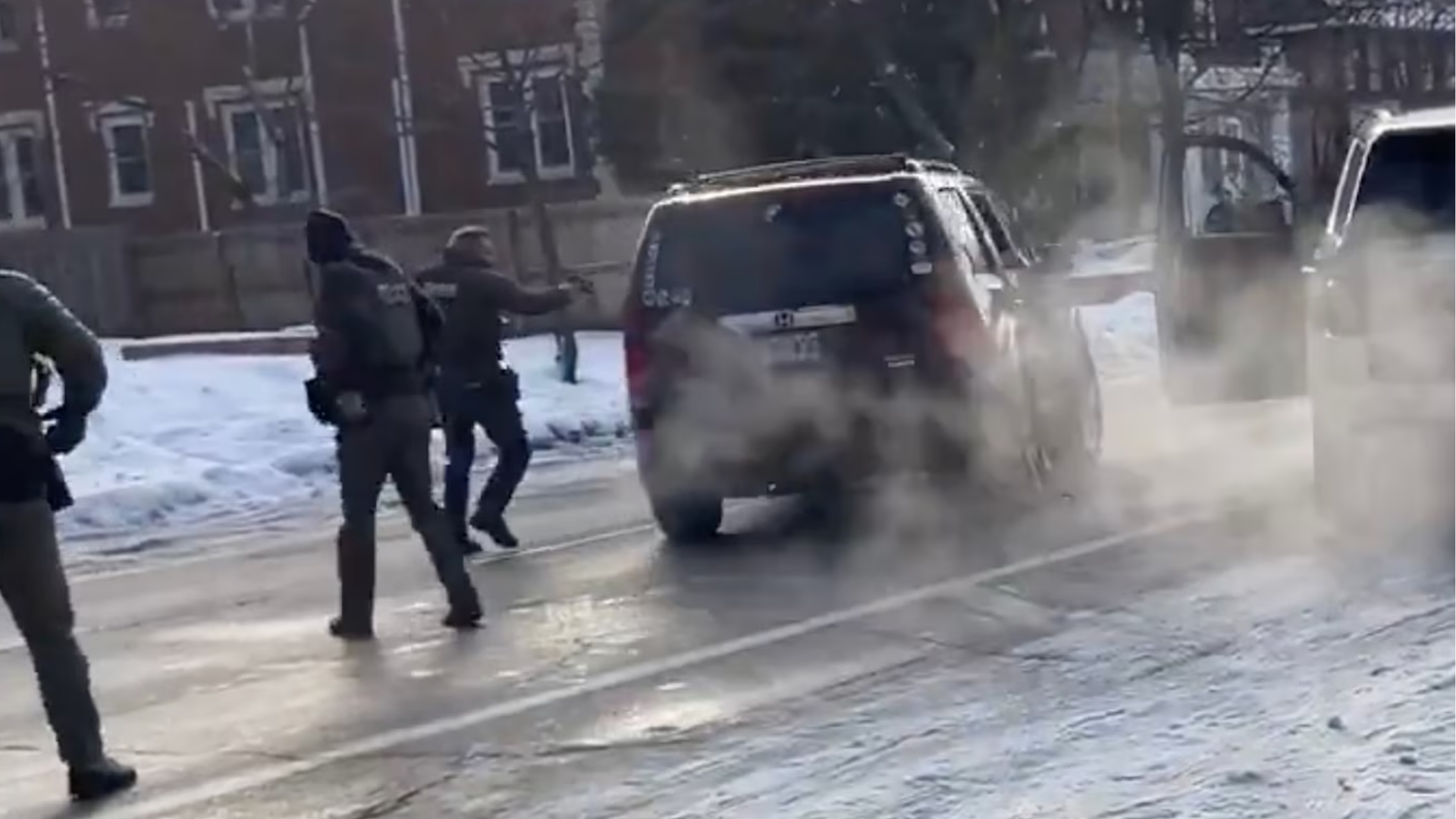 Law enforcement officers are seen after an ICE officer fatally shot the driver of a vehicle during an incident in Minneapolis, Jan. 7, 2026.