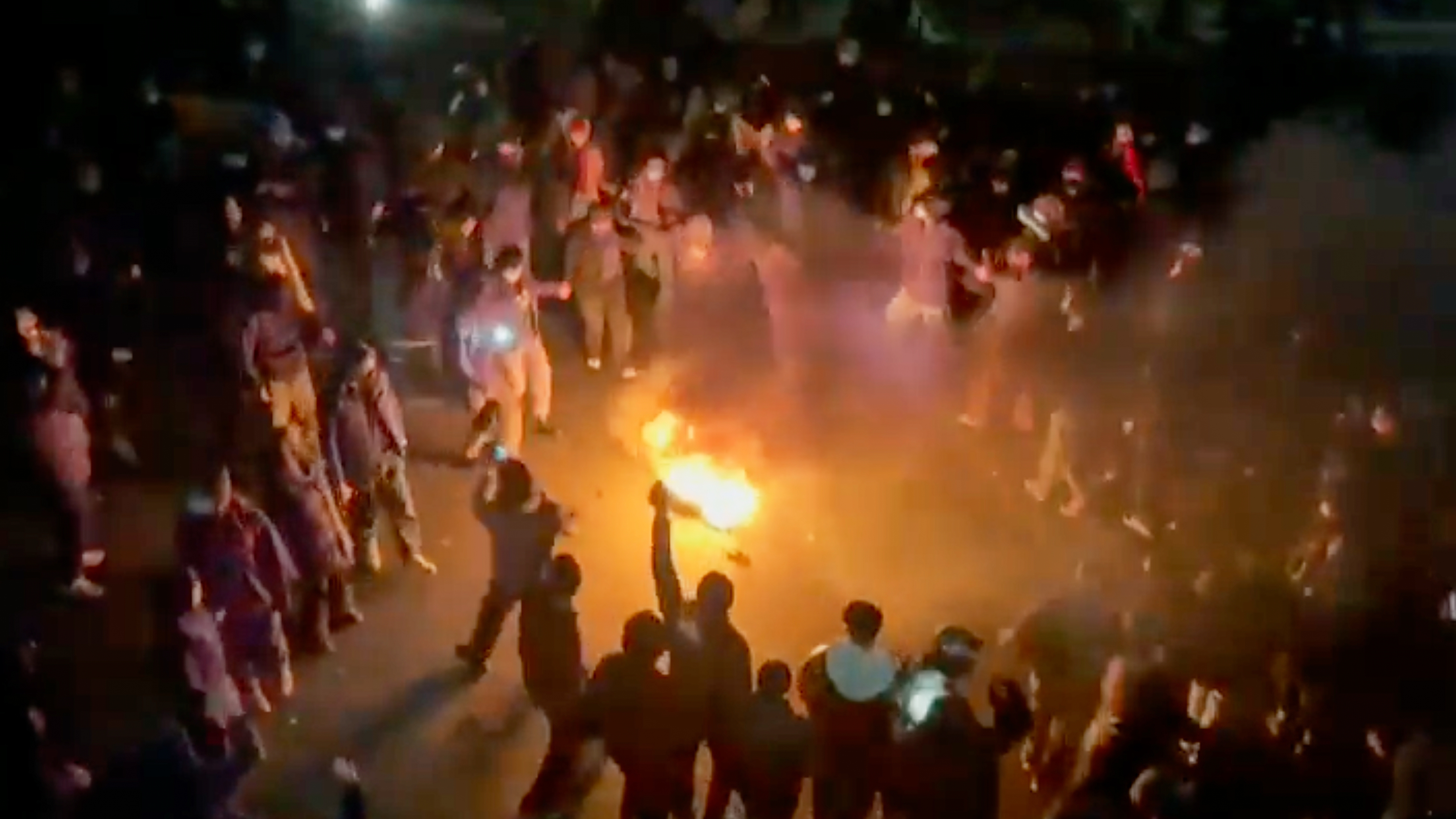 This frame grab from footage circulating on social media shows protesters dancing and cheering around a bonfire in Tehran, Iran, Jan. 9, 2026.