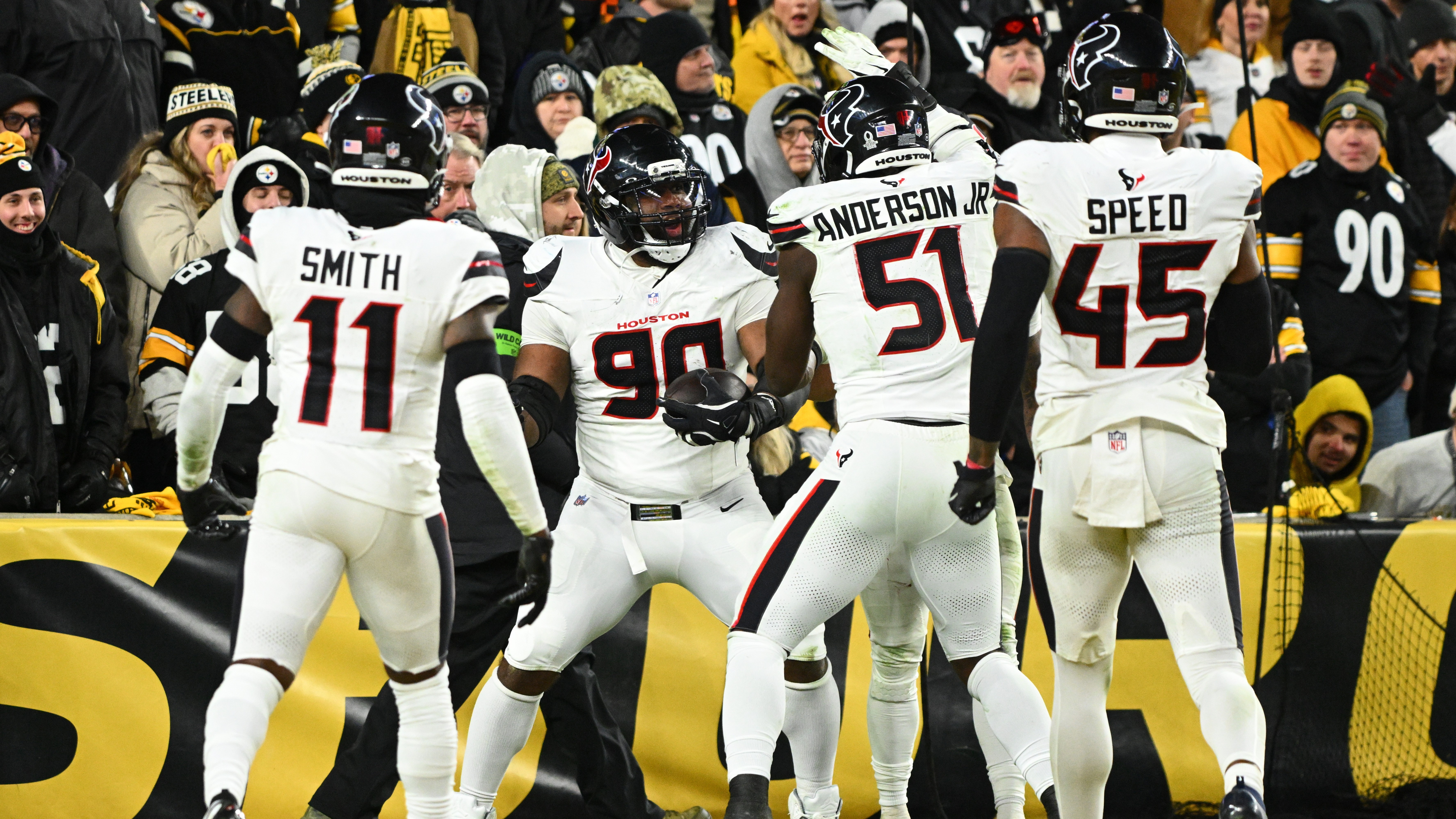 Texans' defensive tackle Sheldon Rankins (90), cornerback Tremon Smith (11), defensive end Will Anderson Jr. (51), and linebacker E.J. Speed (45) during a game on Jan. 12, 2026.