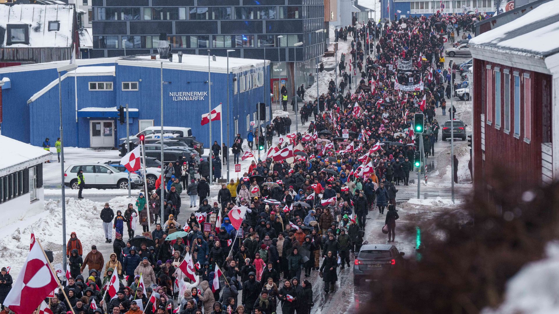 A crowd walks to the US consulate to protest against Trump's policy towards Greenland in Nuuk, Greenland, Saturday, Jan. 17, 2026.