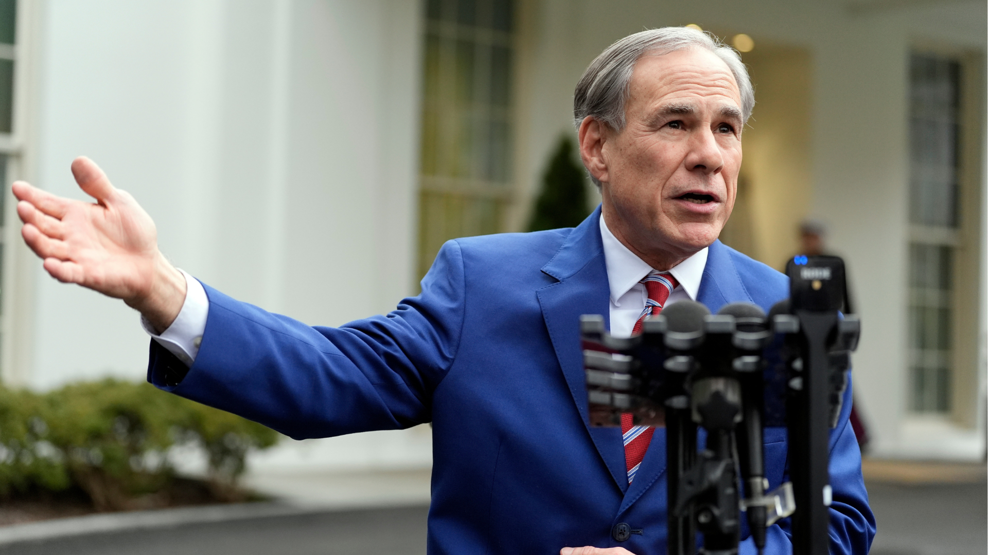 FILE - Texas Gov. Greg Abbott speaks to reporters outside the West Wing of the White House, Feb. 5, 2025, in Washington.