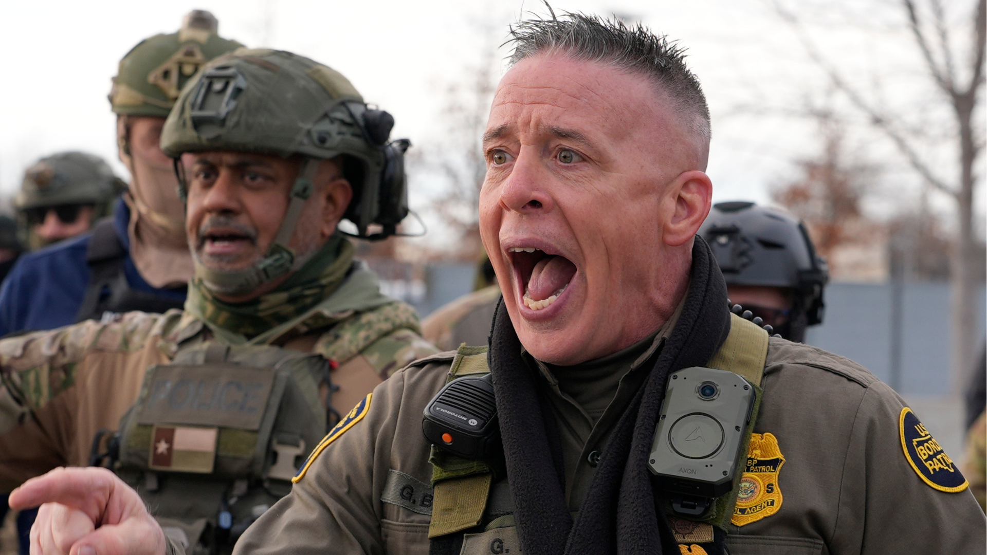 U.S. Border Patrol Cmdr. Gregory Bovino shouts at protesters, Sunday, Jan. 11, 2026, in Minneapolis.