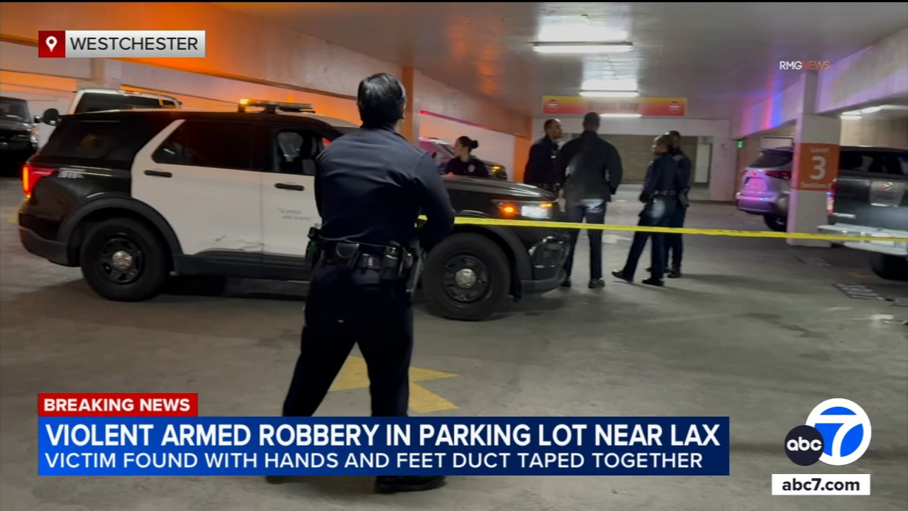 Robbery victim found with hands, feet bound with duct tape in parking garage near LAX, police say