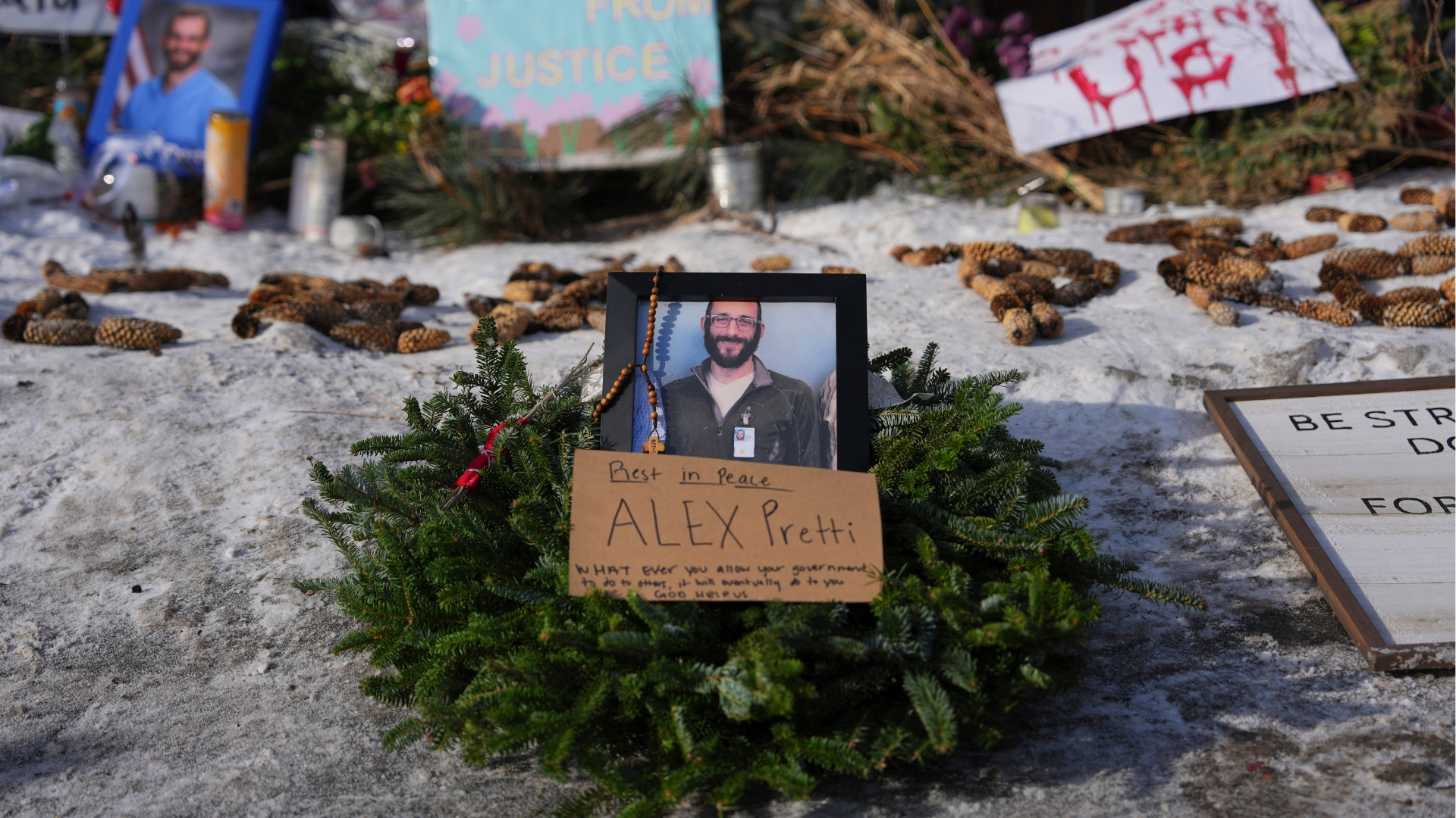 A makeshift memorial is placed where Alex Pretti was fatally shot by a U.S. Border Patrol officer yesterday, in Minneapolis, Sunday, Jan. 25, 2026. 