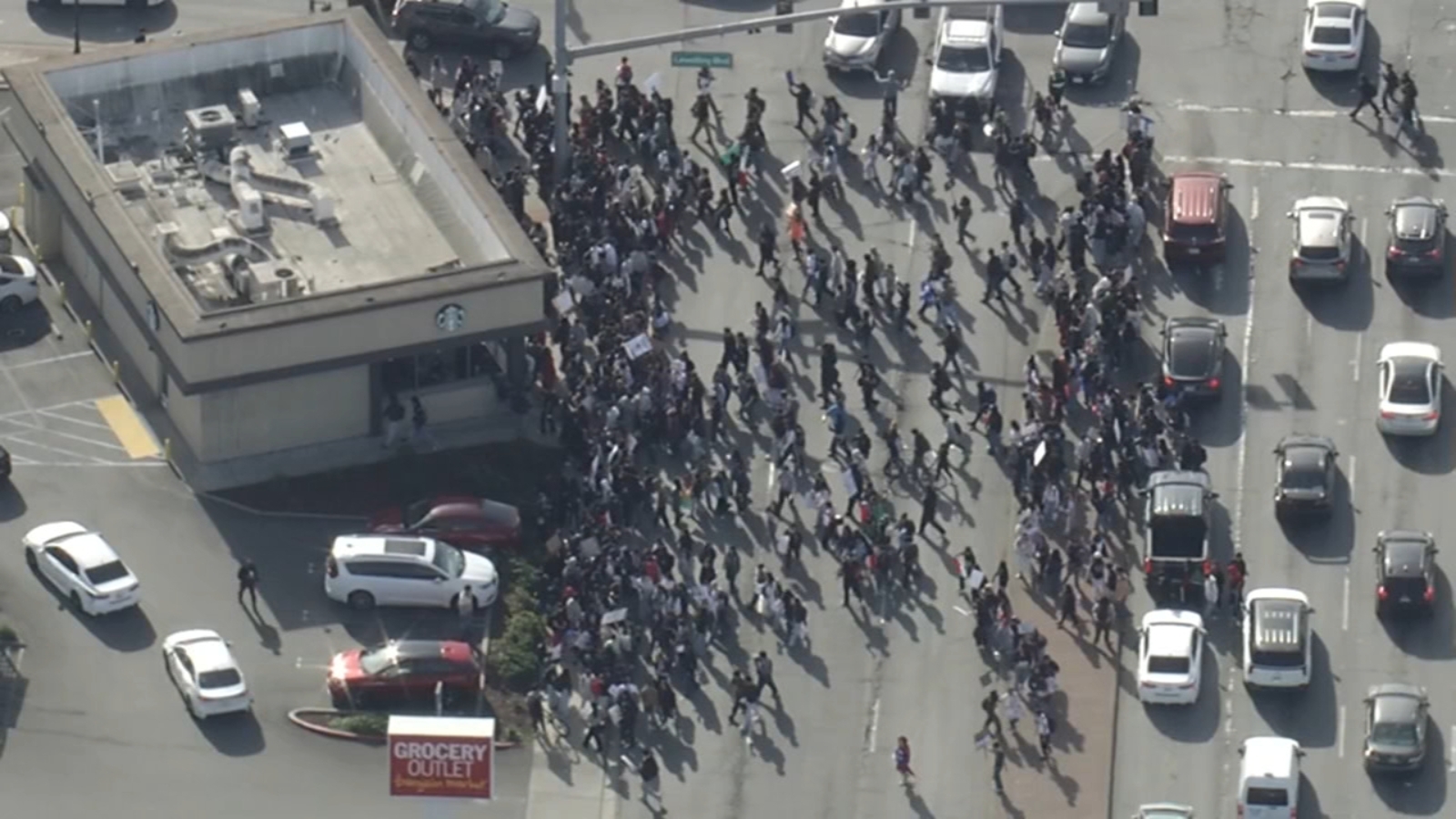 Large student walkout protesting ICE takes over busy East Bay road