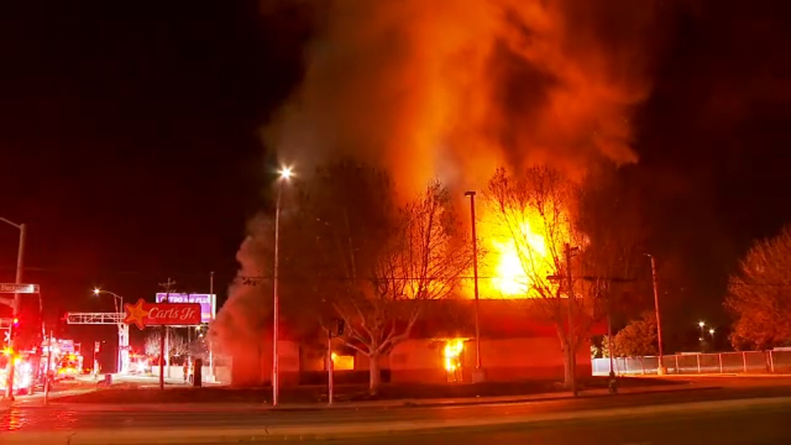 Crews battling large fire at former Carl's Jr. location near Fresno City College
