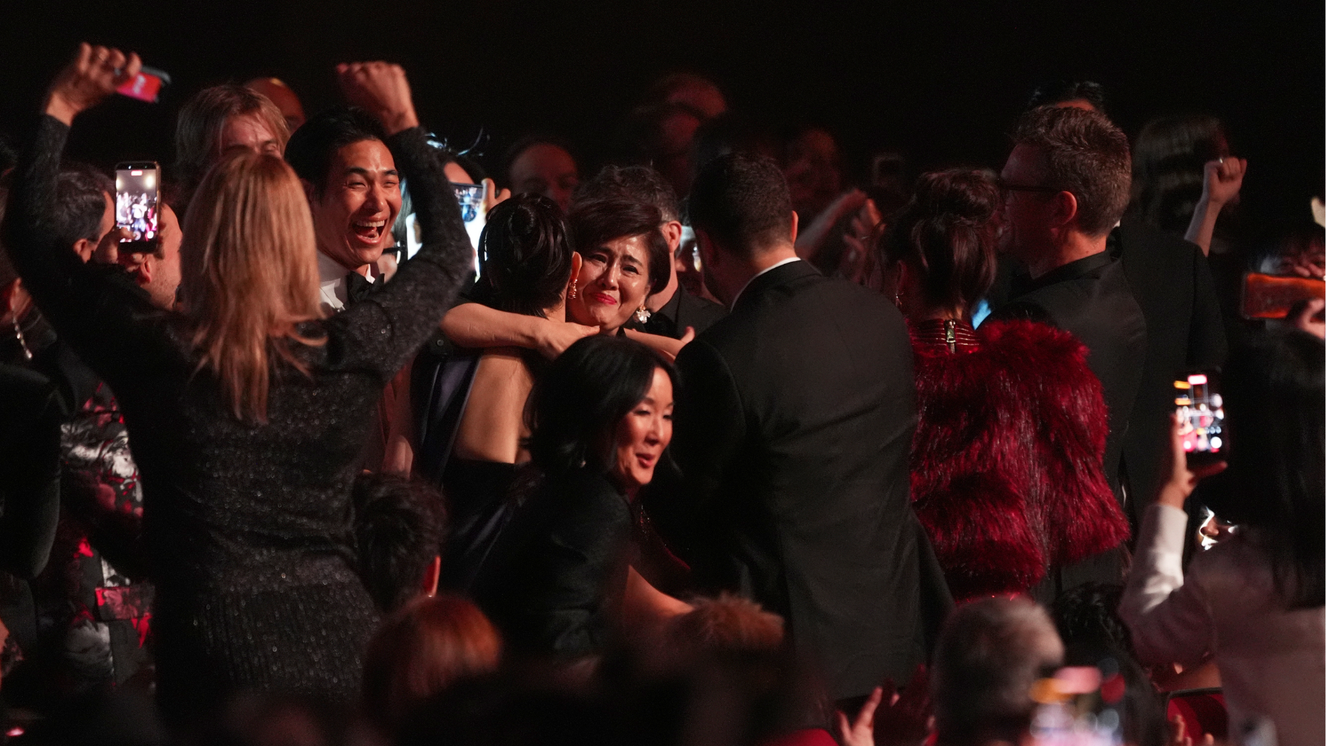 The team from KPop Demon Hunters react in the audience to winning the award for best song written for visual media for "Golden" during the 68th annual Grammy Awards on Sunday, Feb. 1, 2026, in Los Angeles. (AP Photo/Chris Pizzello)