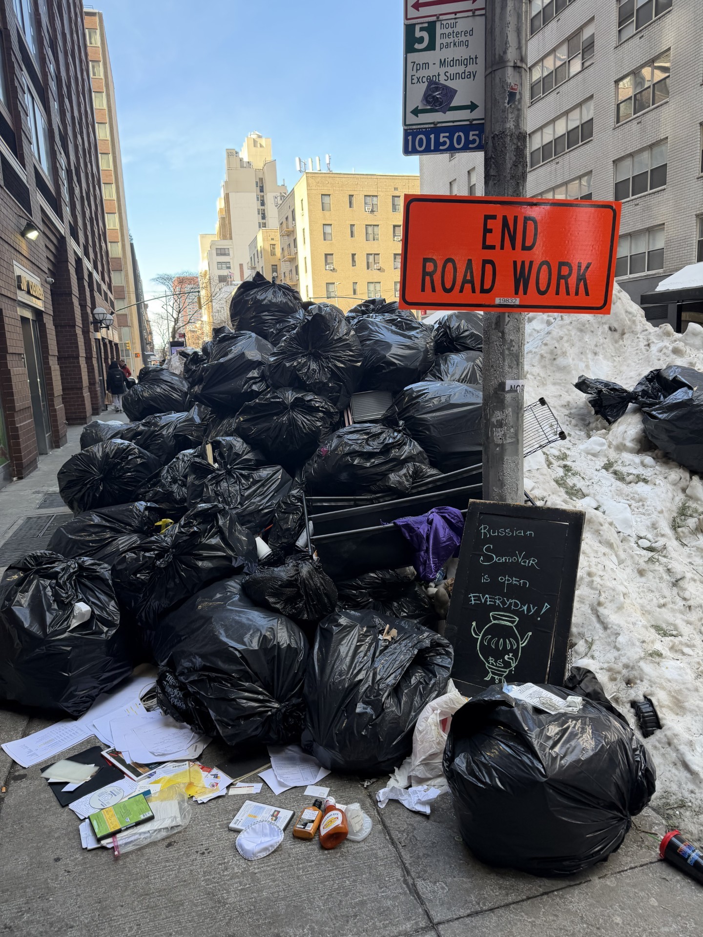 Large trash piles spotted at the corner of 52nd Street and 8th Avenue in Manhattan.