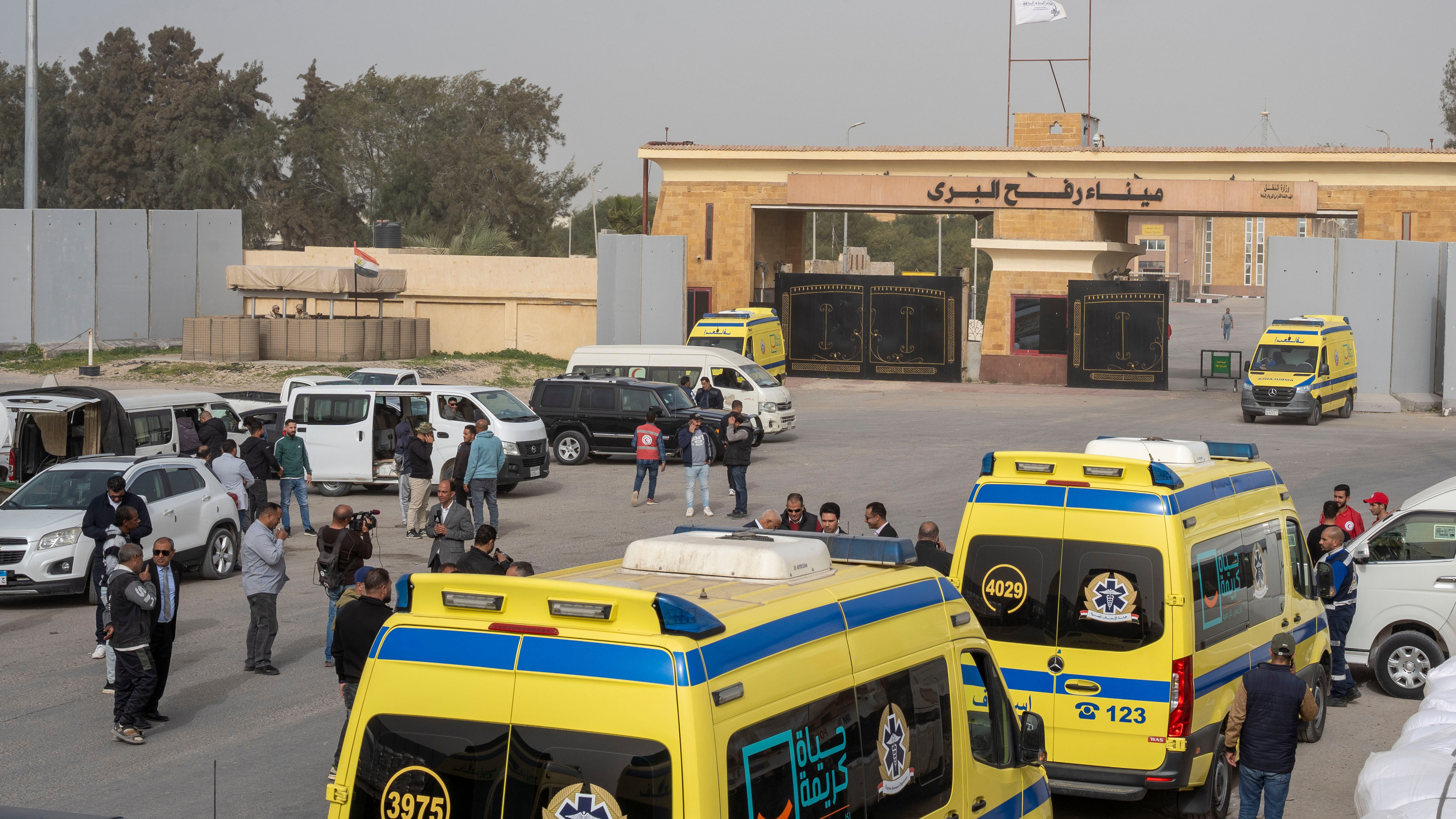 Ambulances line up to enter the Egyptian gate of the Rafah crossing into the Gaza Strip, in Rafah, Egypt, Monday, Feb. 2, 2026.