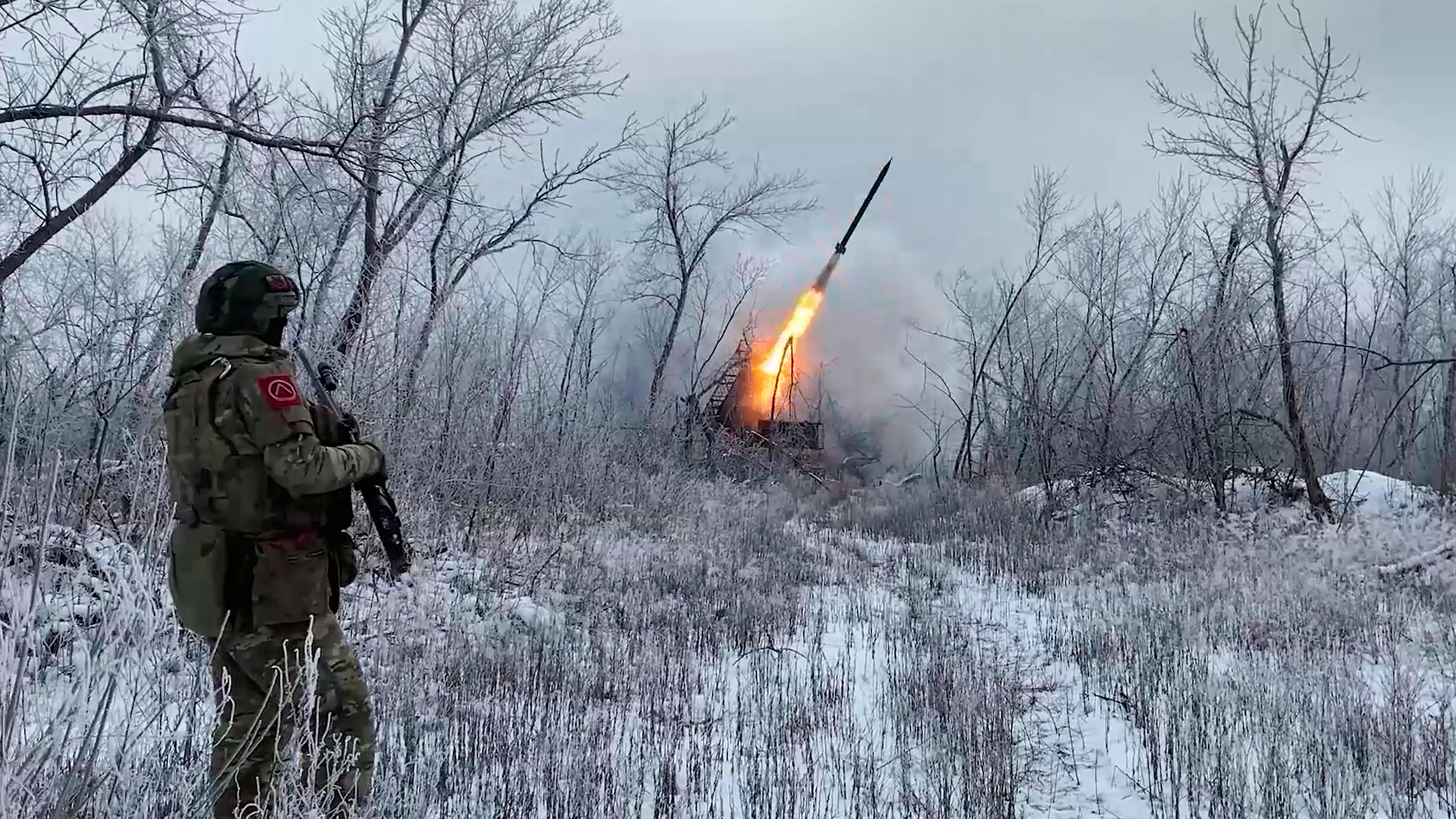 In this image made from video provided by Russian Defense Ministry Press Service on Wednesday, Feb. 4, 2026, Russian Multiple rocket launcher TOS-1A fires towards Ukrainian positions on an undisclosed location in Ukraine. 