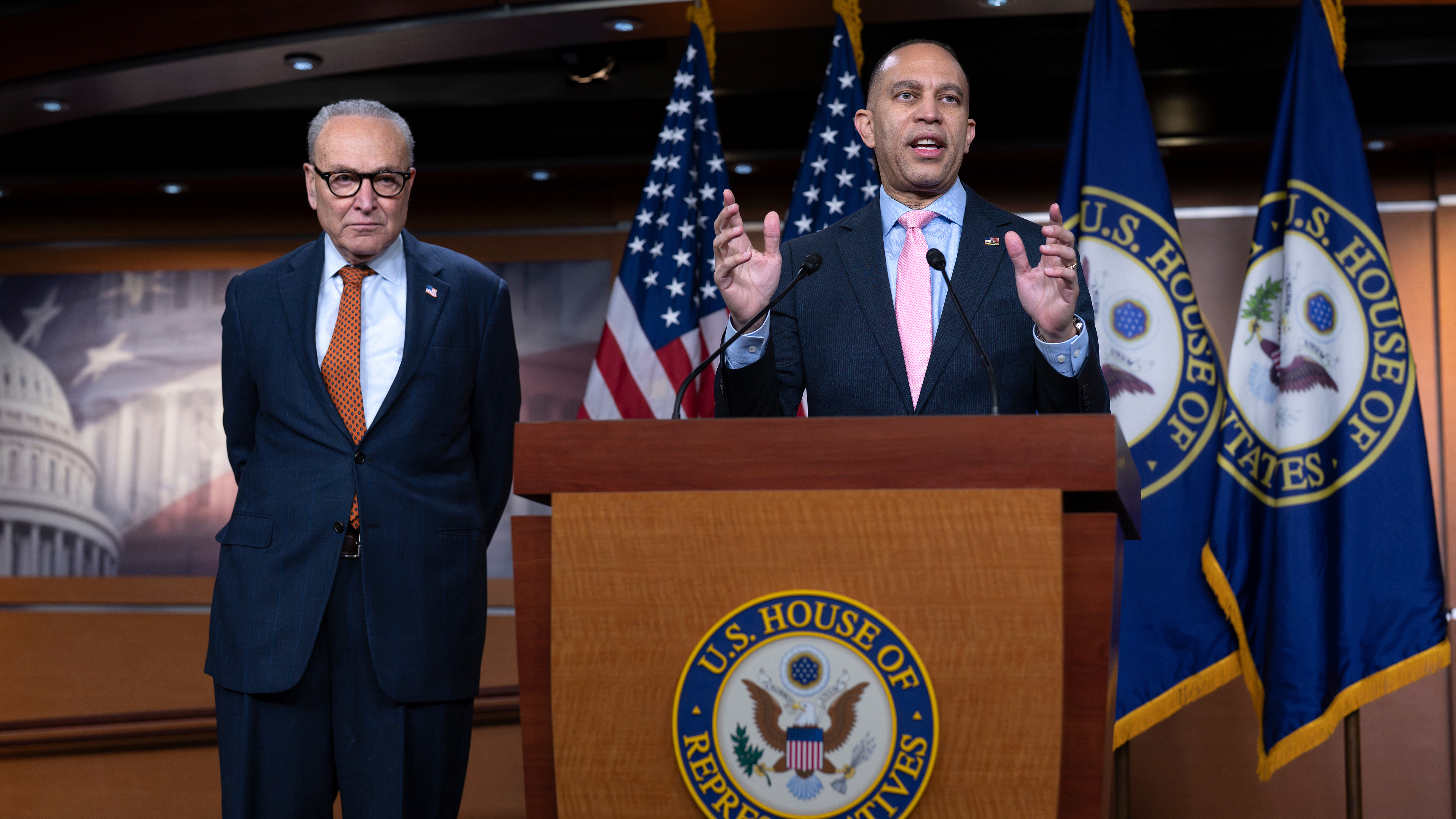 House Minority Leader Hakeem Jeffries, D-N.Y., speaks to reporters as Senate Minority Leader Chuck Schumer, D-N.Y. left, listens during a news conference at the Capitol in Washington, Thursday, Jan. 8, 2026.