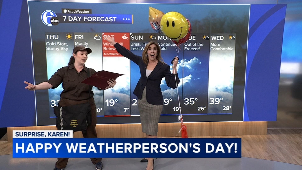 Singing telegram surprises Karen Rogers for Weatherperson's Day!