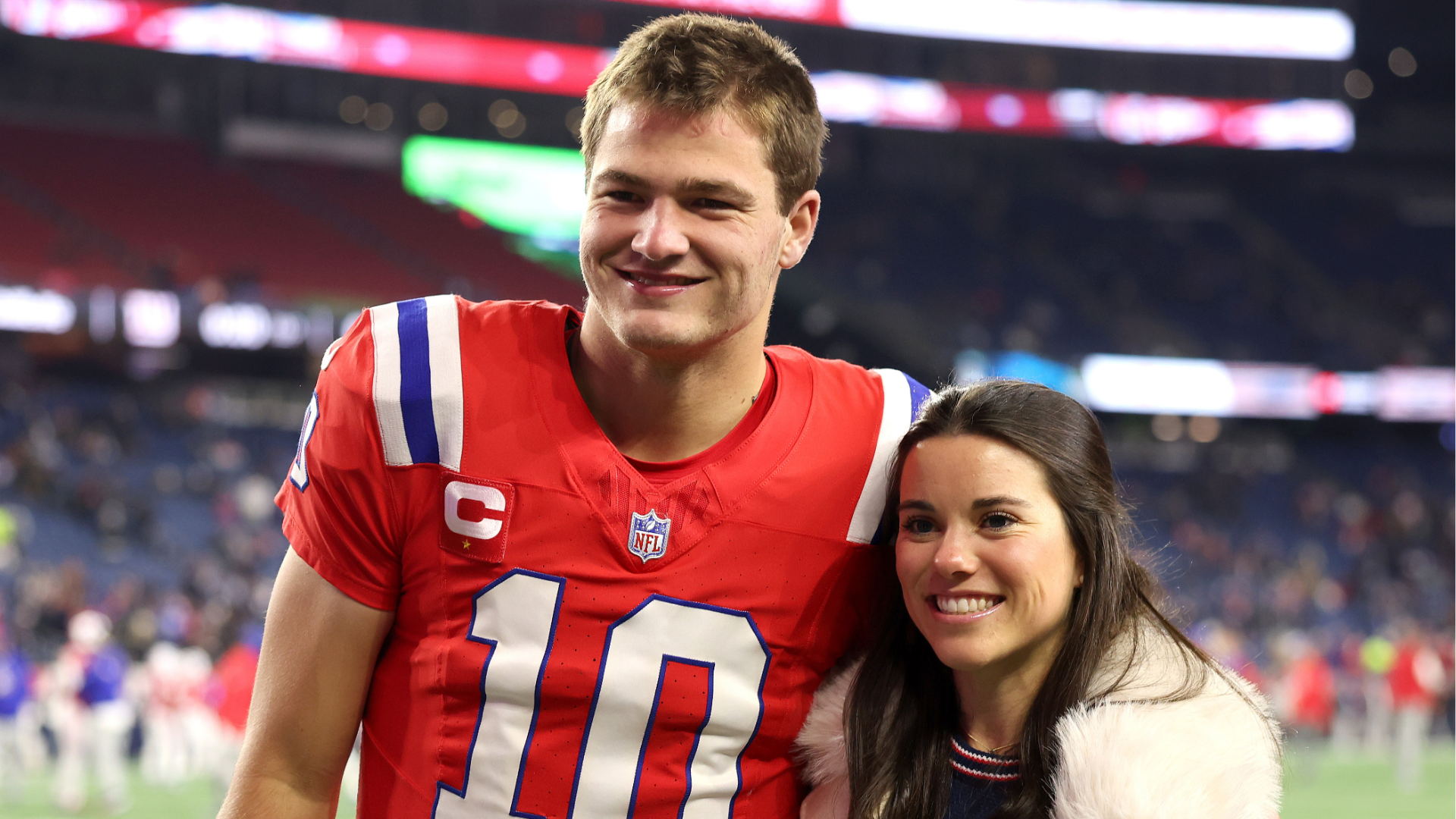 Drake Maye #10 of the New England Patriots and his wife Ann Michael Maye pose for a photo prior to the game against the New York Giants at Gillette Stadium on December 01, 2025 in Foxborough, Massachusetts.
