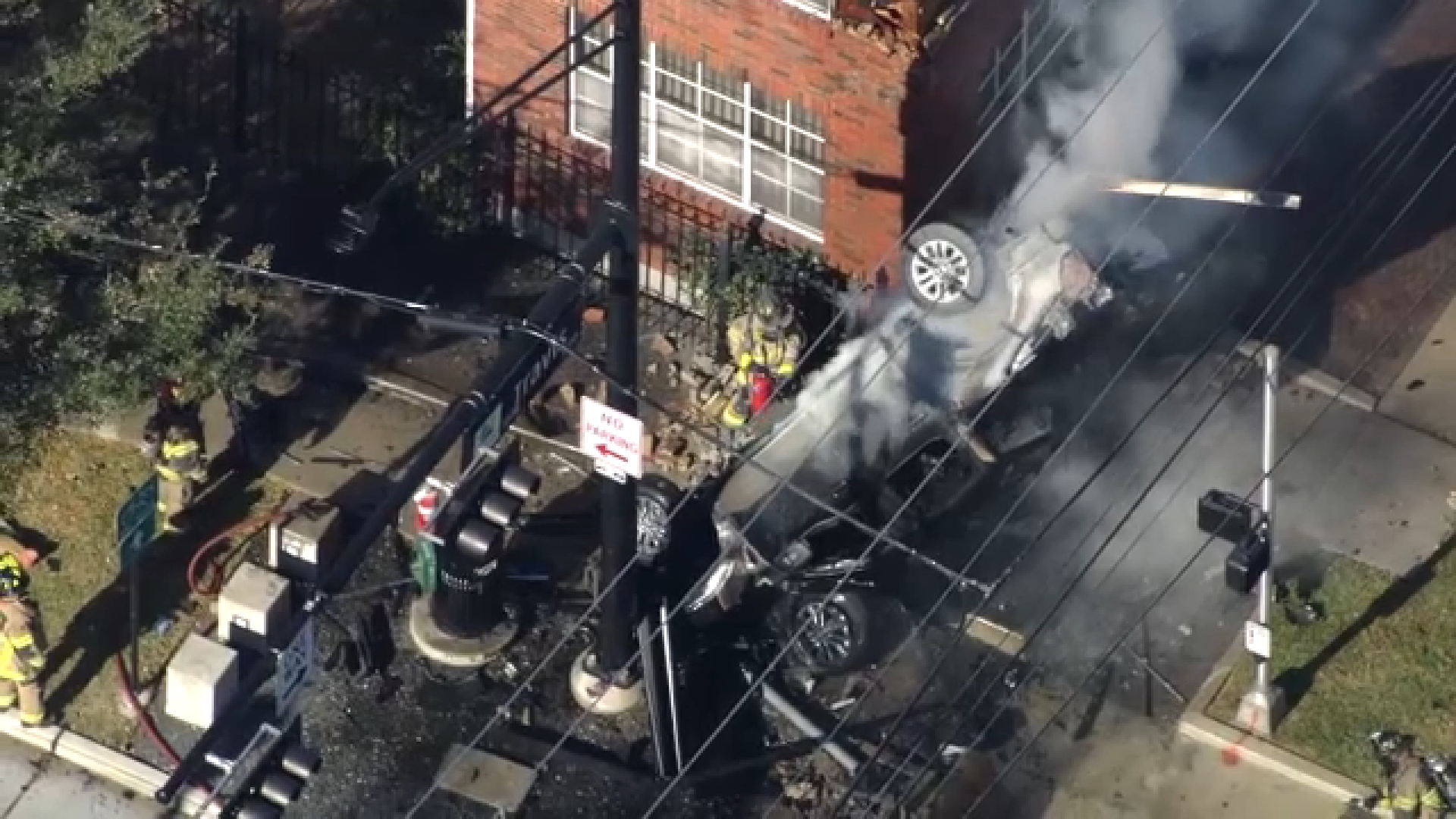 SkyEye was over a major crash that left a vehicle upright and in flames in Midtown.