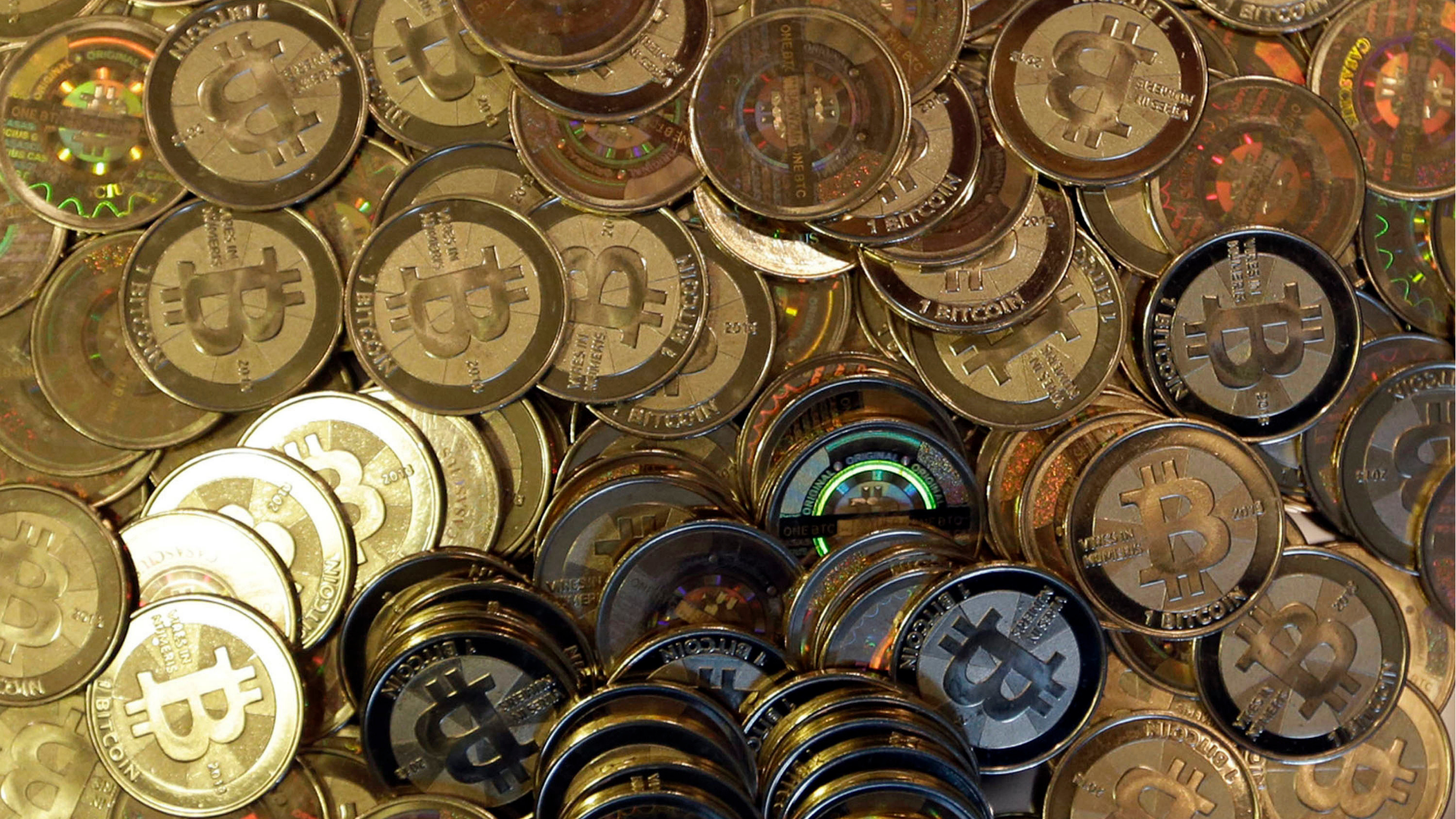 FILE - Bitcoin tokens are seen on April 3, 2013, in Sandy, Utah.