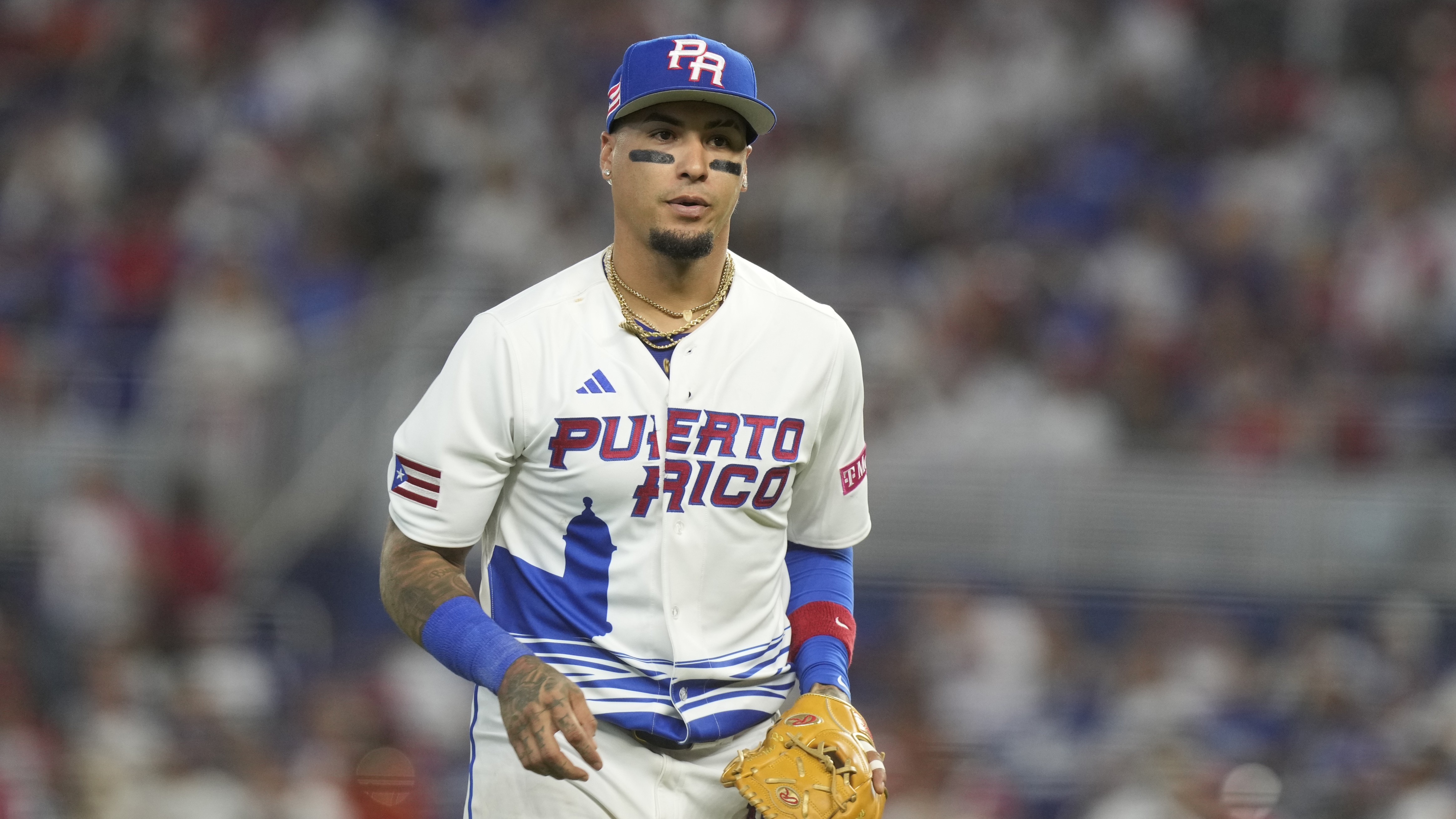 Puerto Rico second baseman Javier Baez (9) returns to the dugout during a World Baseball Classic game against Nicaragua, Saturday, March 11, 2023, in Miami.