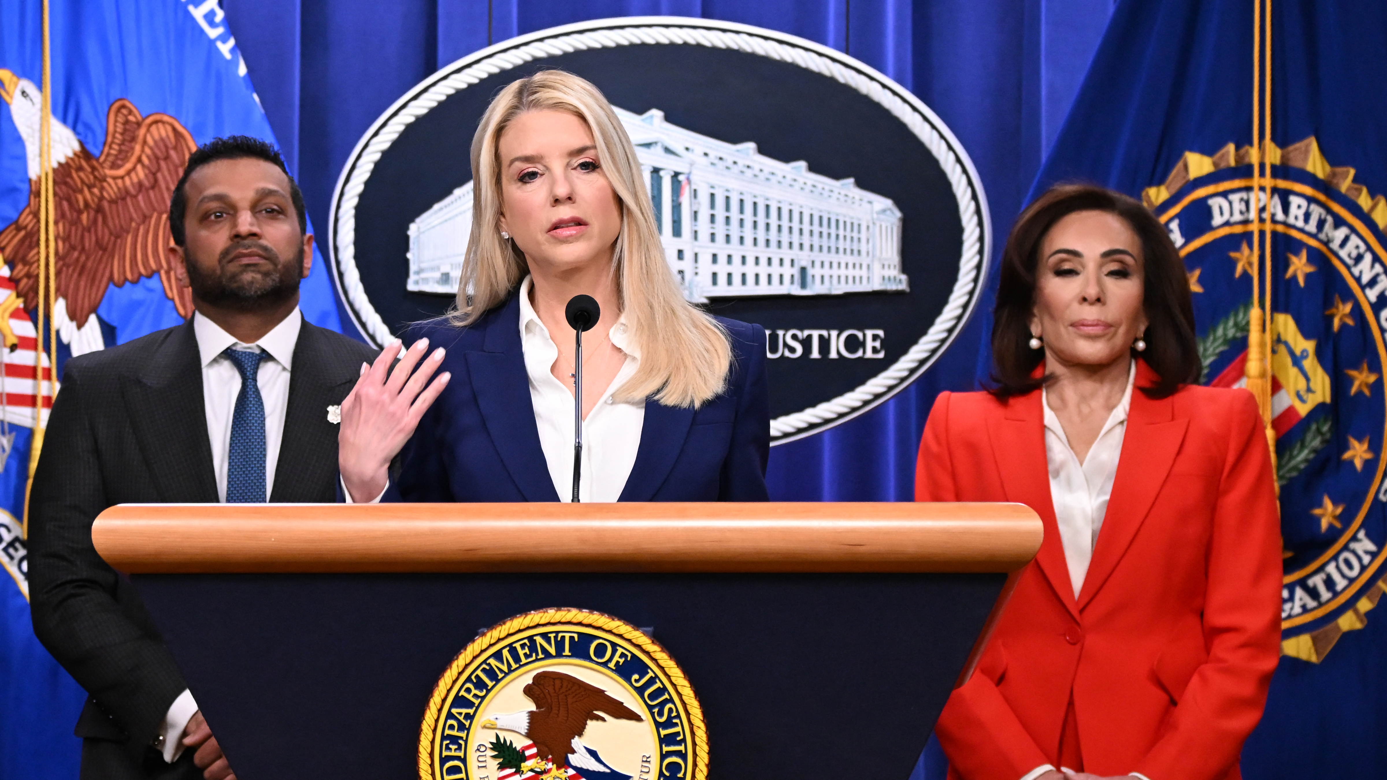 US Attorney General Pam Bondi (C) speaks during a news conference alongside FBI Director Kash Patel (L) and US Attorney for the District of Columbia Jeanine Pirro (R) at Department of Justice headquarters in Washington, DC, on February 6, 2026.
