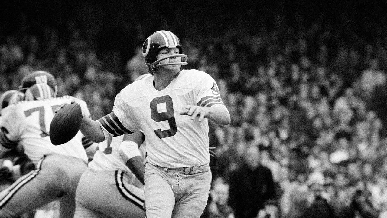 FILE - Washington quarterback Sonny Jurgensen looks to pass against the New York Giants during an NFL football game in 1974.