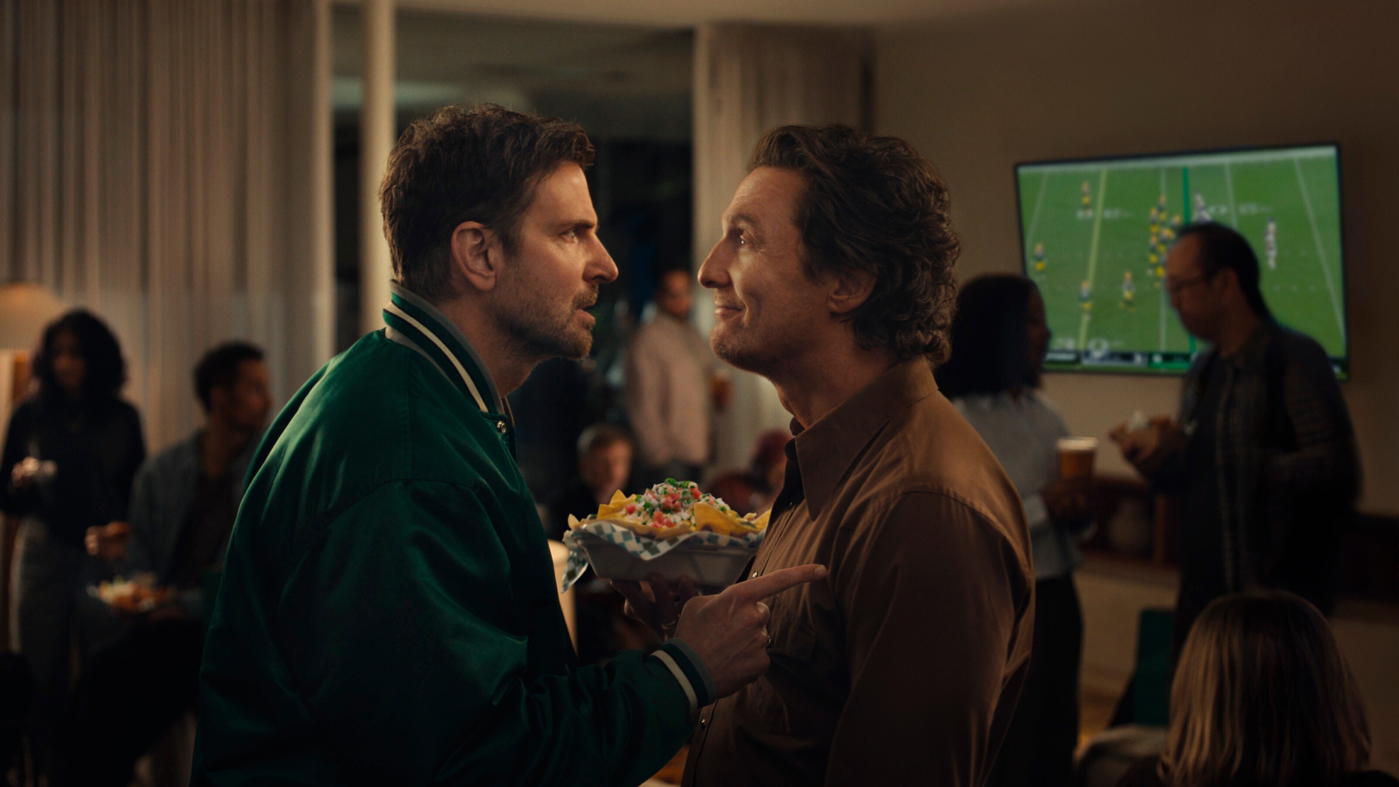 This undated image provided by Uber Eats shows Bradley Cooper, left, and Matthew McConaughey in a scene from the Uber Eats 2026 Super Bowl NFL football spot.