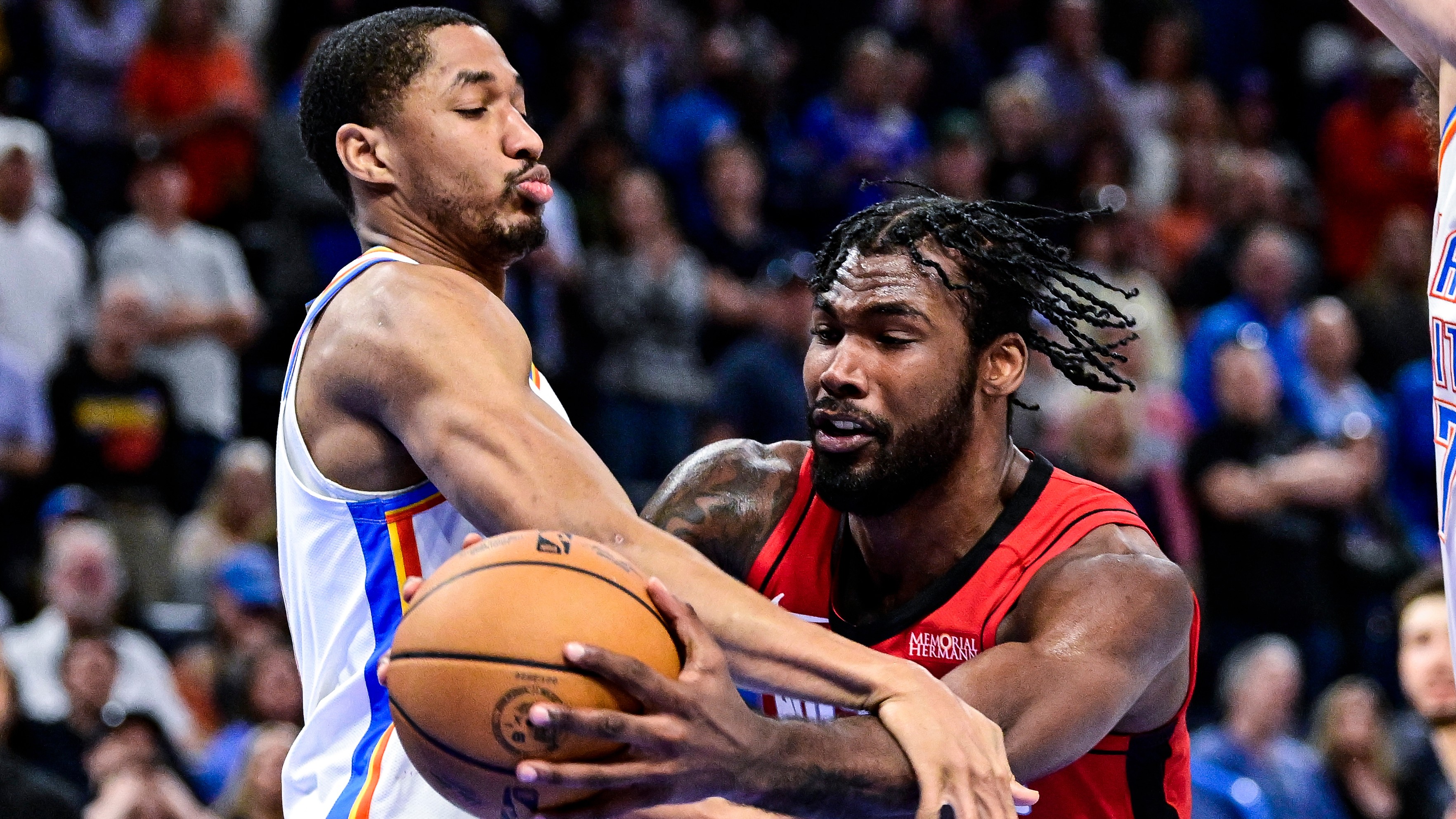 Houston Rockets forward Tari Eason pressures by Oklahoma City Thunder guard Aaron Wiggins during the second half of an NBA basketball game on Feb. 7, 2026, in Oklahoma City.