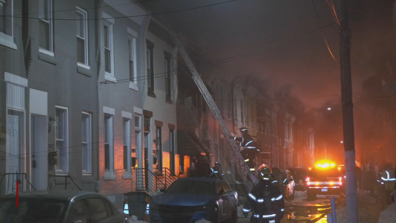 Crews work to extinguish row home fire in Brewerytown