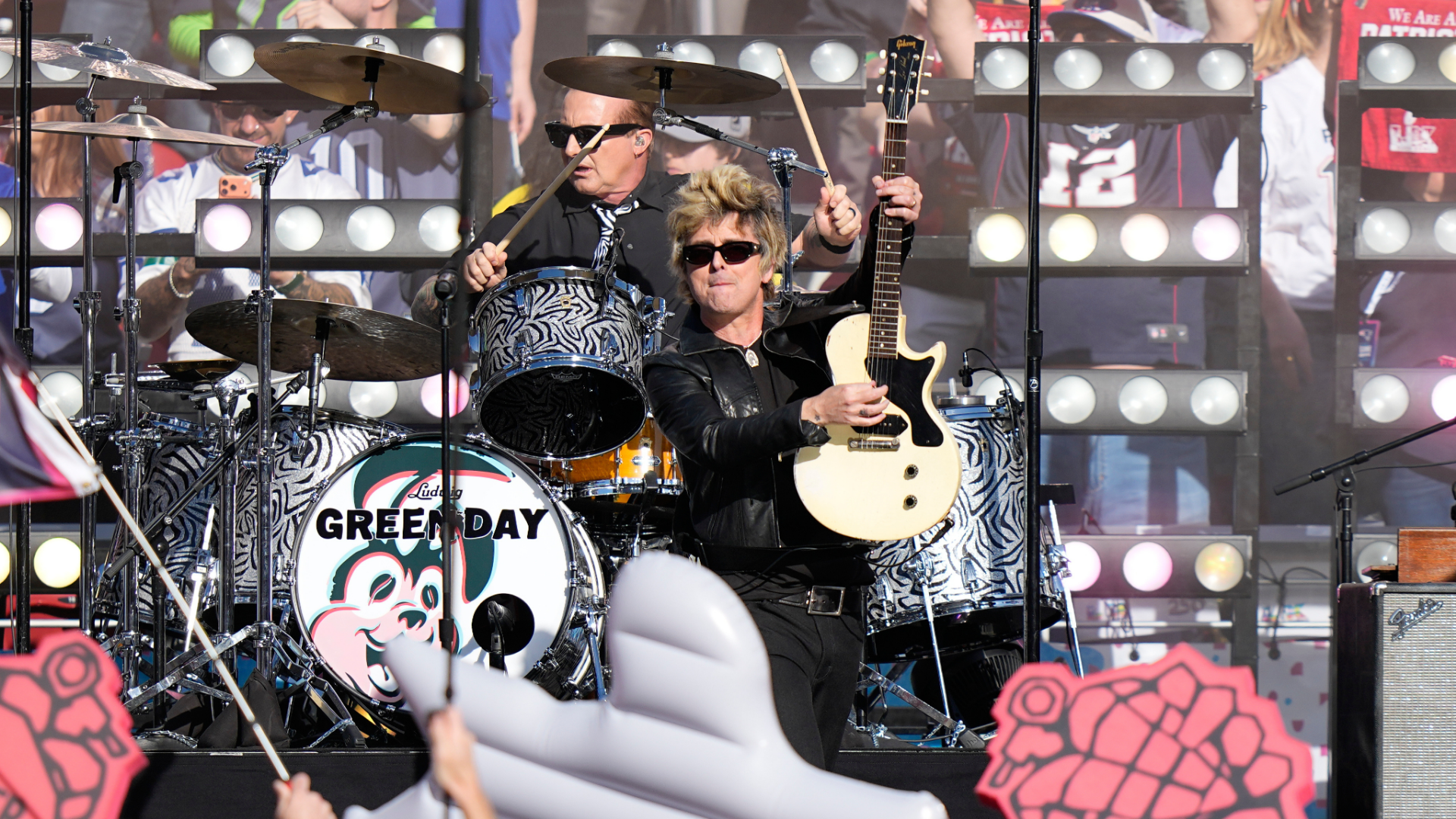 Billie Joe Armstrong, right, and Tre Cool of Green Day perform before the NFL Super Bowl 60 football game between the Seattle Seahawks and the New England Patriots, Sunday, Feb. 8, 2026, in Santa Clara, Calif.