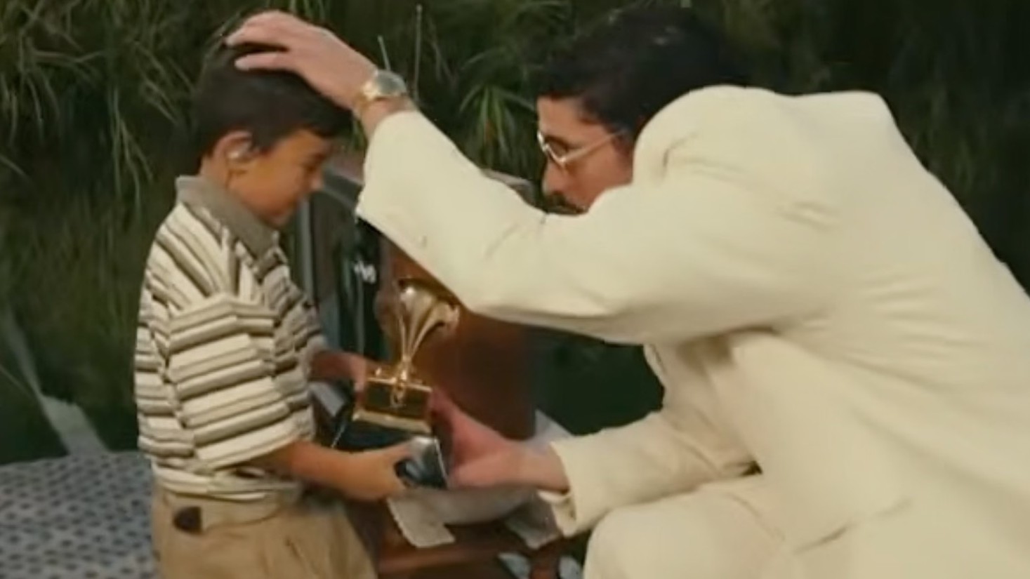 Bad Bunny presents a Grammy Award to a child during the halftime show at Super Bowl 60, February 8, 2026 in Santa Clara, Calif.