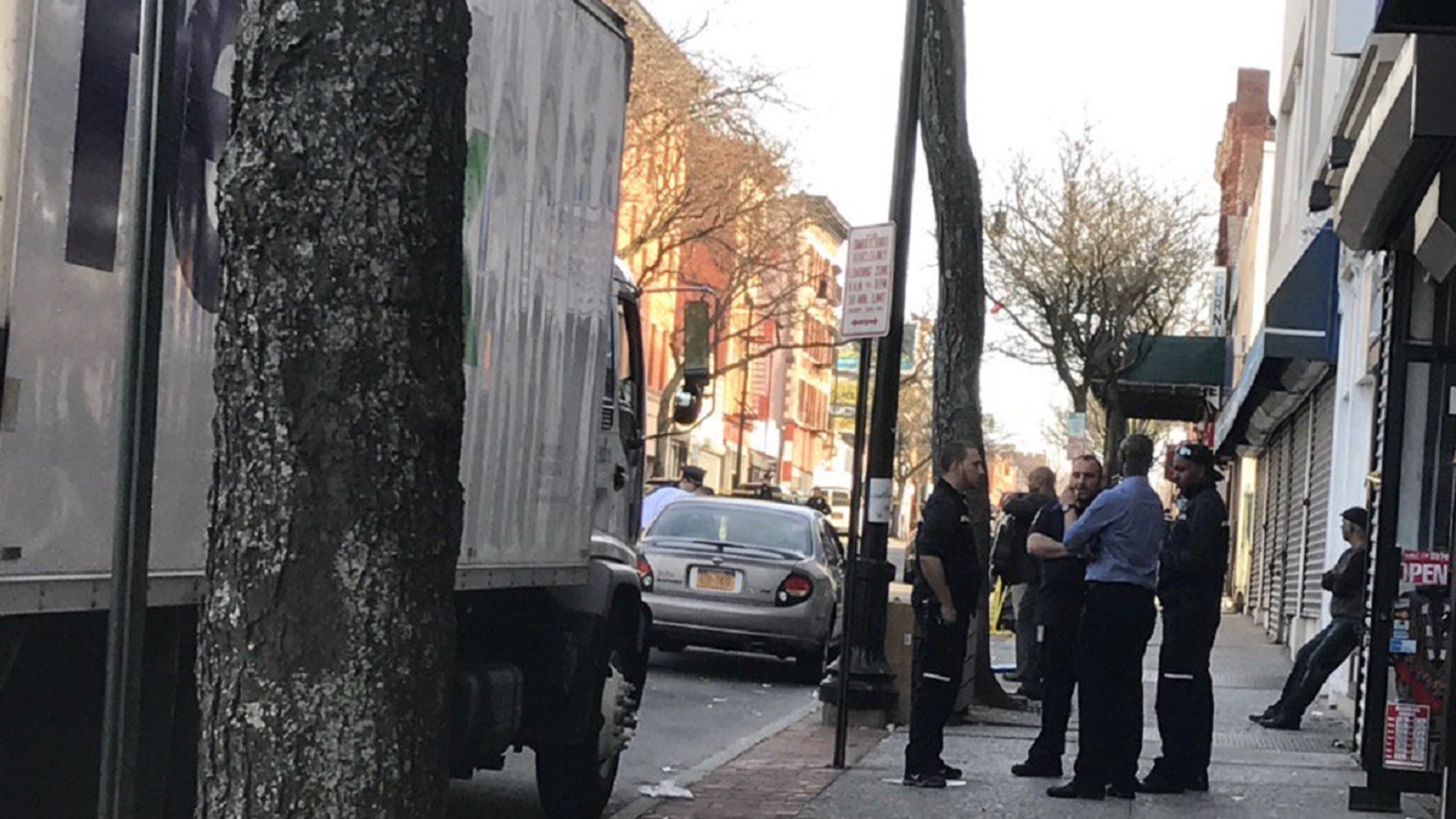 1 man shot and injured, bullets also hit FedEx truck, parked car in