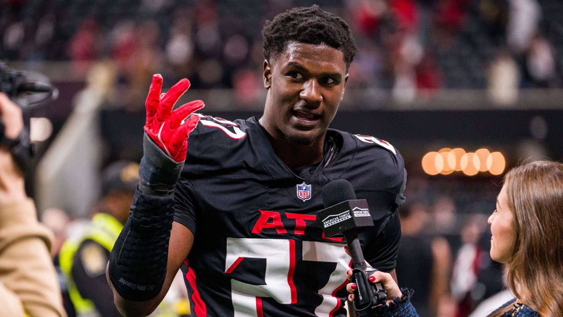 FILE - Atlanta Falcons linebacker James Pearce Jr. (27) is interviewed after an NFL football game against the New Orleans Saints, on Jan. 4, 2026, in Atlanta.