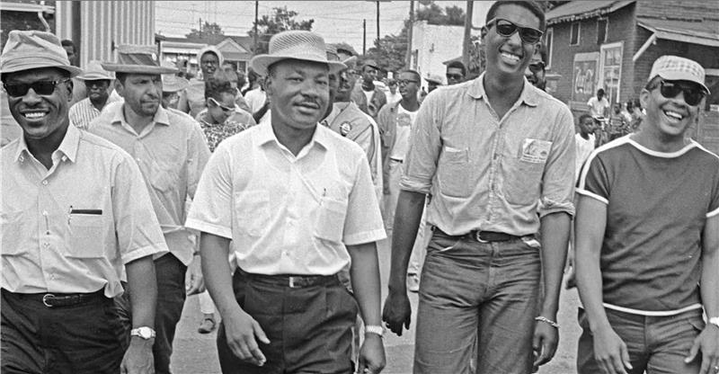 Dr. Martin Luther king Kr. taking part in the March Against Fear during the summer of 1966.