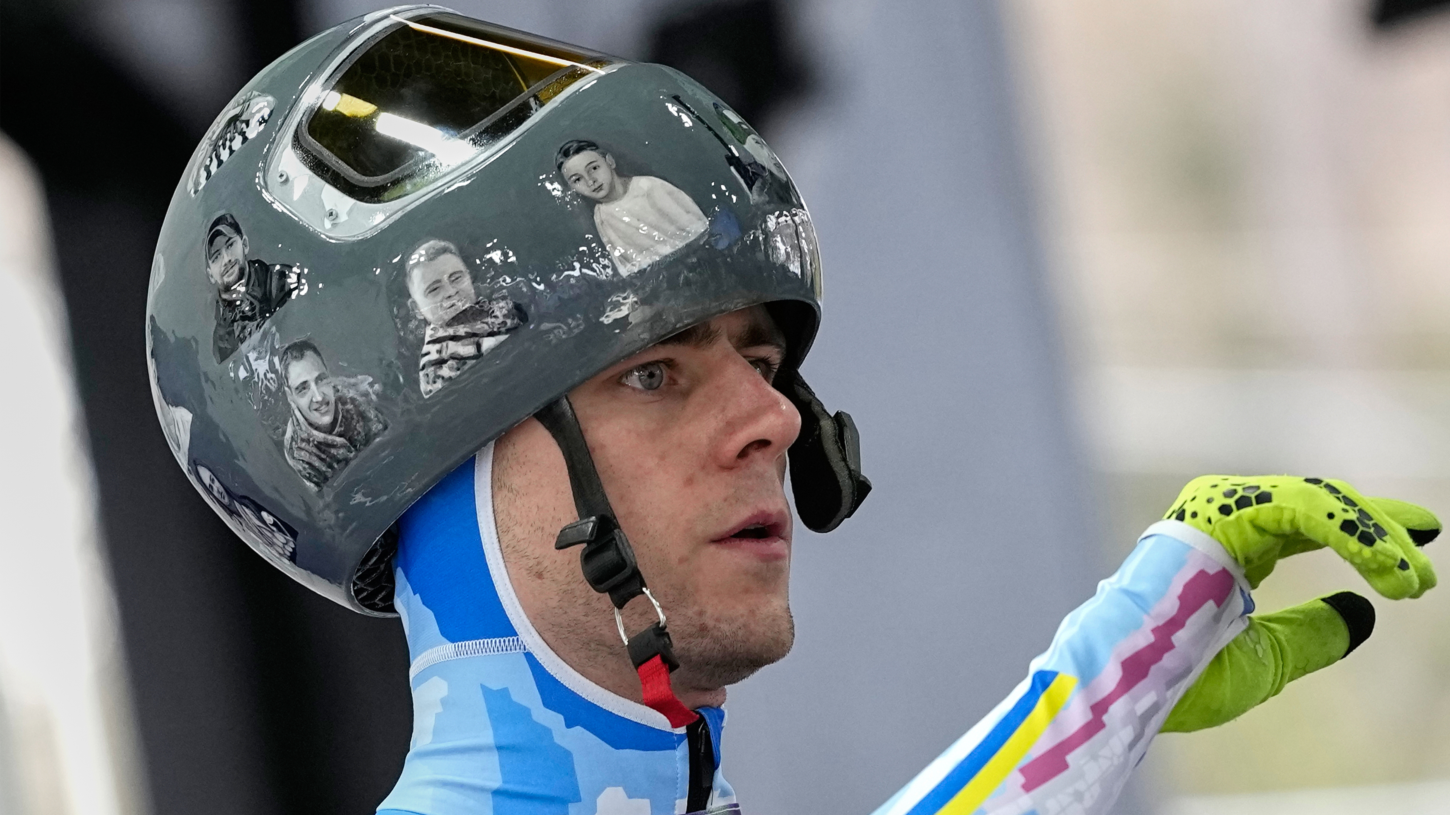 Ukraine's Vladyslav Heraskevych arrives at the finish during a men's skeleton training session at the 2026 Winter Olympics, in Cortina d'Ampezzo, Italy, Tuesday, Feb. 10, 2026.