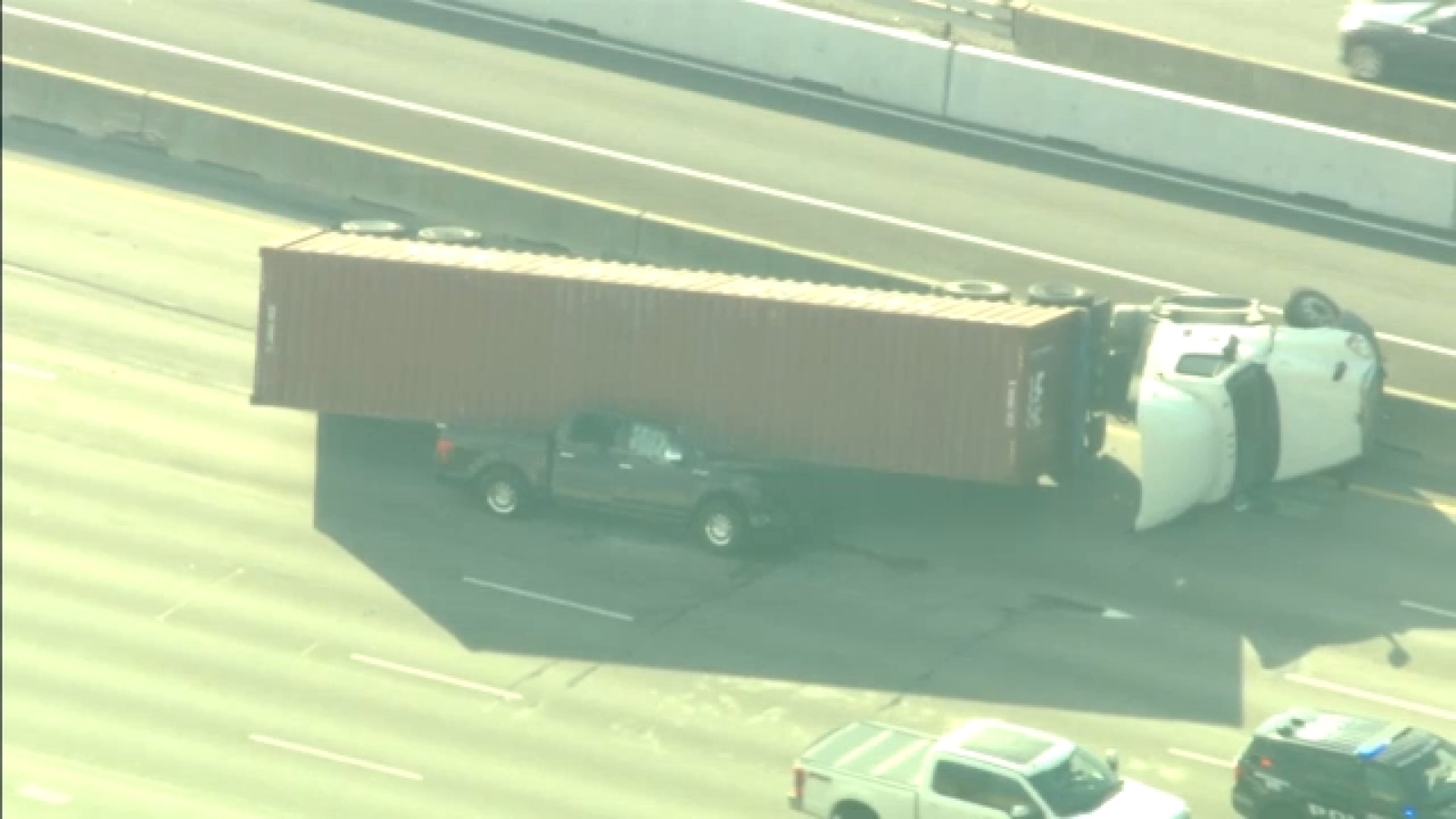 Truck seen smashed underneath 18-wheeler on Southwest Freeway, no injuries reported, officials say