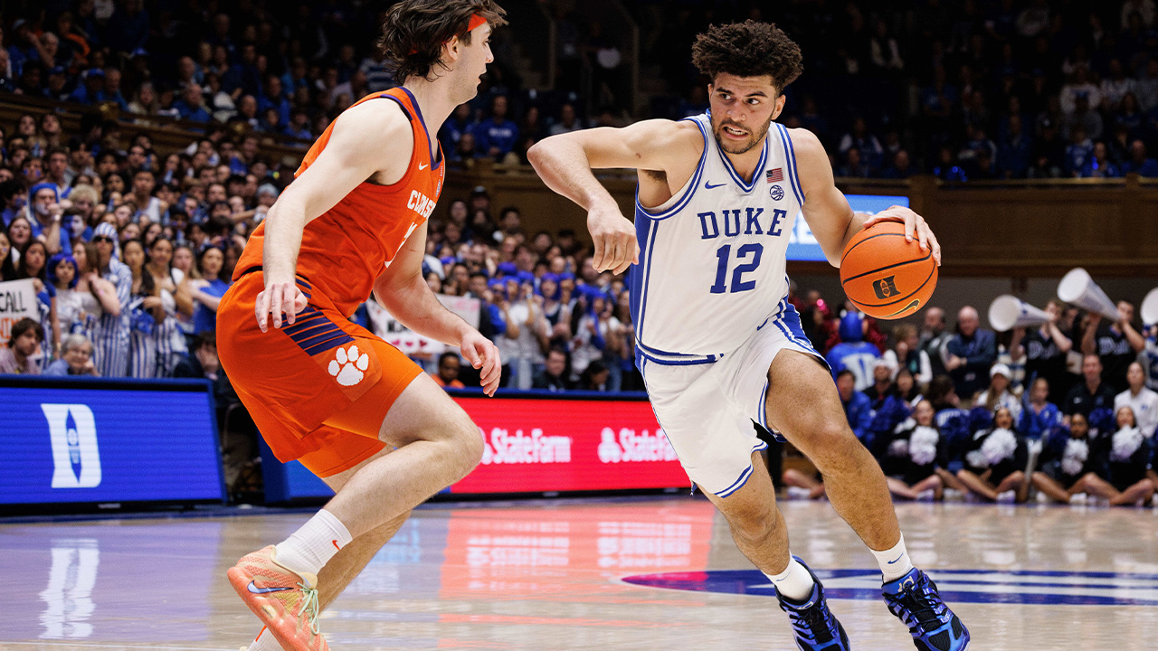 Duke's Cameron Boozer (12) drives against Clemson's Carter Welling, left, during the second half of an NCAA college basketball game in Durham, N.C., Saturday, Feb. 14, 2026