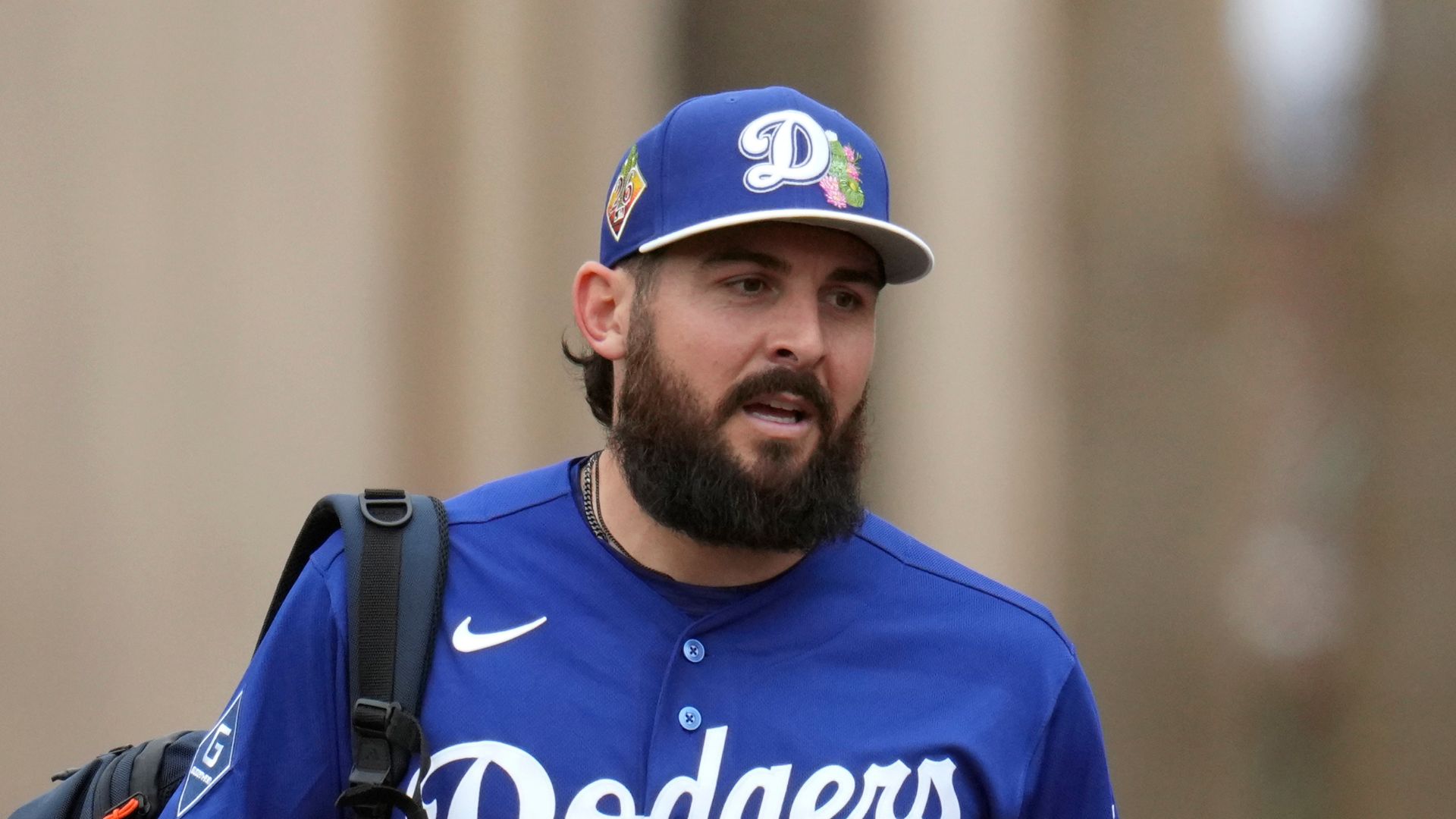 Los Angeles Dodgers pitcher Alex Vesia walks out of the clubhouse prior to working out during spring training baseball Friday, Feb. 13, 2026, in Phoenix.