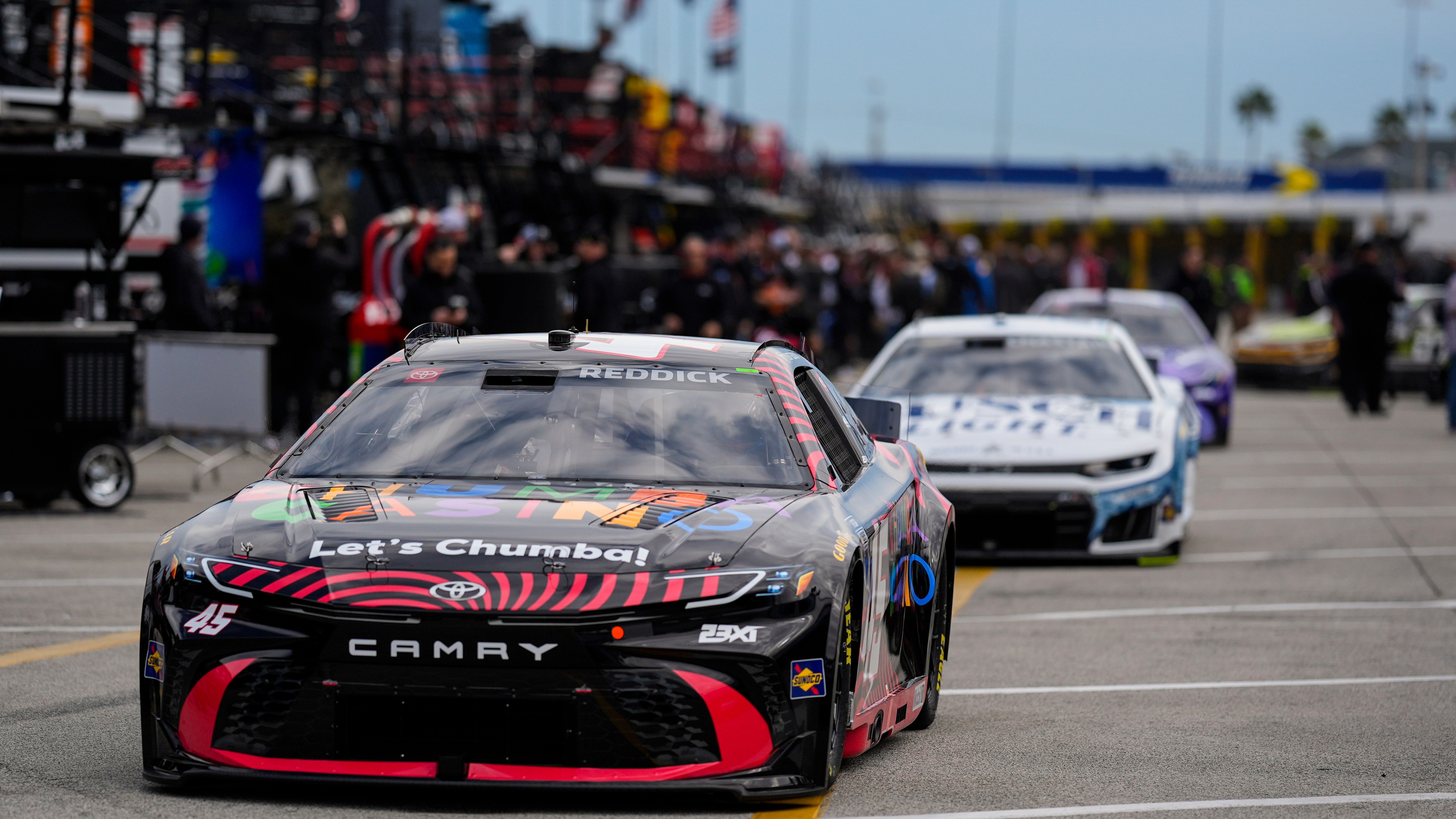 Driver Tyler Reddick leads other cars out to the track during a NASCAR Daytona 500 practice, Wednesday, Feb. 11, 2026, in Daytona, Fla. (AP Photo/Mike Stewart)
