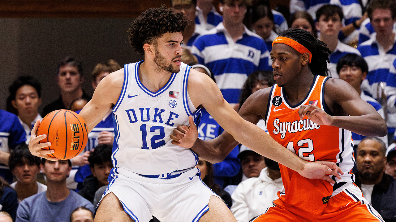 Duke's Cameron Boozer handles the ball as Syracuse's William Kyle III, right, defends on Monday night in Durham.