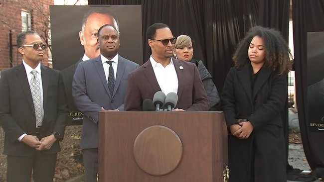 Reverend Jesse Jackson speaking at a podium