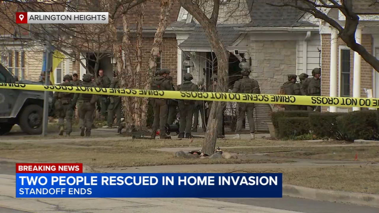 Suburban home invasion suspect in custody after stand off, 2 rescued