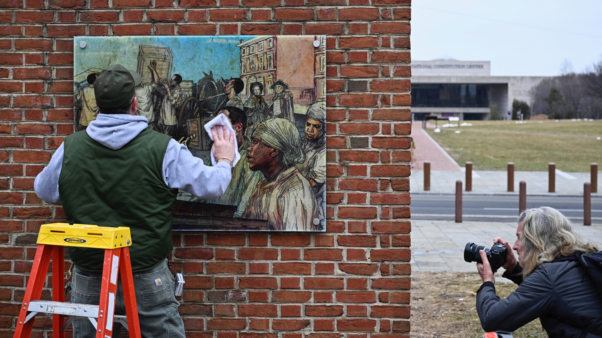 Panels that were part of an exhibit on slavery at the President's House Site in Philadelphia are put back Thursday, Feb. 19, 2026.