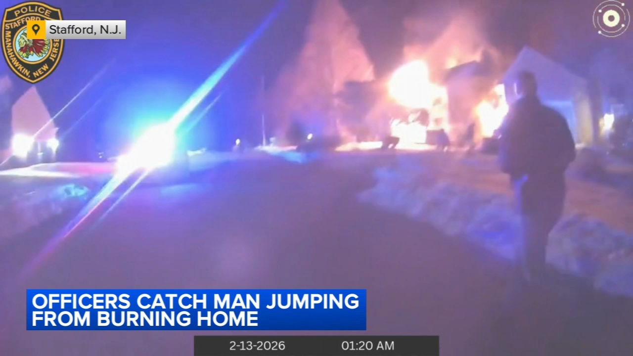 Police body cam captures the moment a man is rescued from a burning house in Ocean County