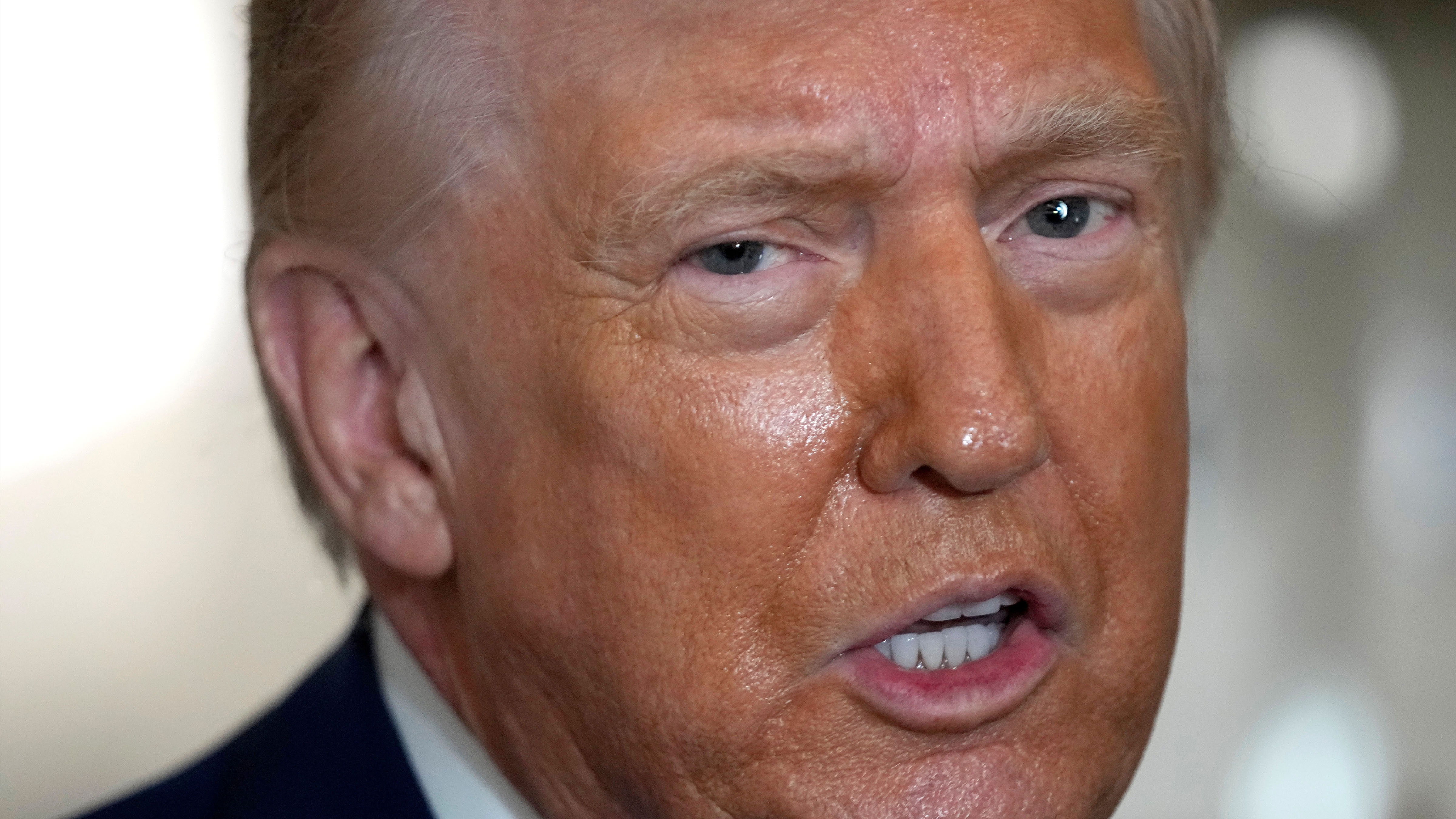 President Donald Trump speaks to reporters aboard Air Force One shortly before takeoff, Thursday, Feb. 19, 2026, at Joint Base Andrews, Md. 