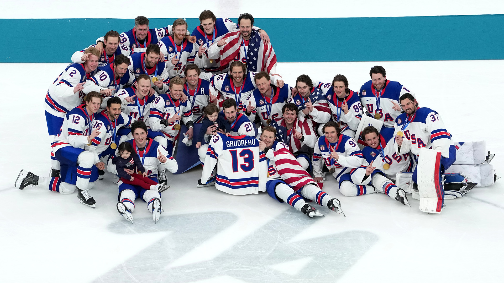 U.S. players pose for pictures with the jersey of the late Johnny Gaudreau after their win in the gold medal game at the 2026 Winter Olympics in Milan, Italy, on Feb. 22, 2026.