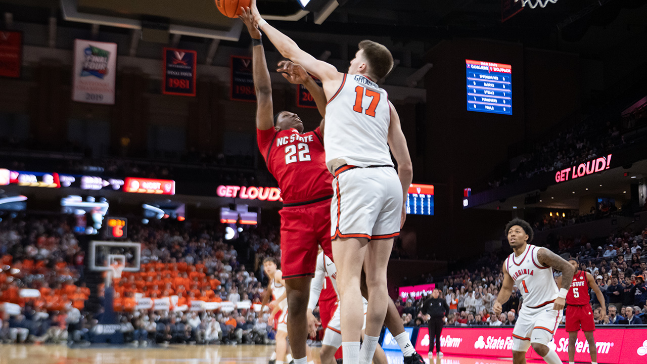 NC State's Ven-Allen Lubin has his shot blocked by Virginia center Johann Grünloh on Tuesday in Charlottesville, Virginia.