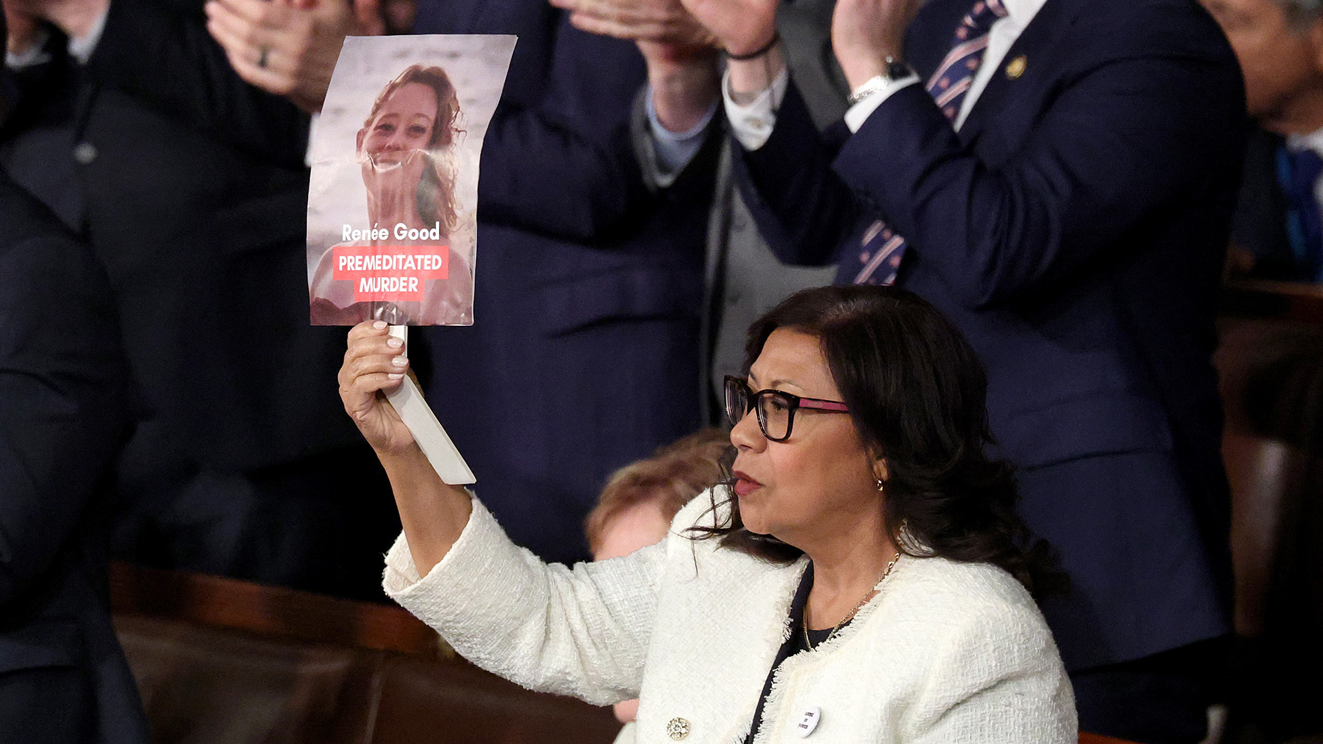 Rep. Norma Torres (D- CA) holds up a photo of Minnesota shooting victim Renee Good during President Donald Trump's State of the Union address on Feb. 24, 2026, in Washington, DC.