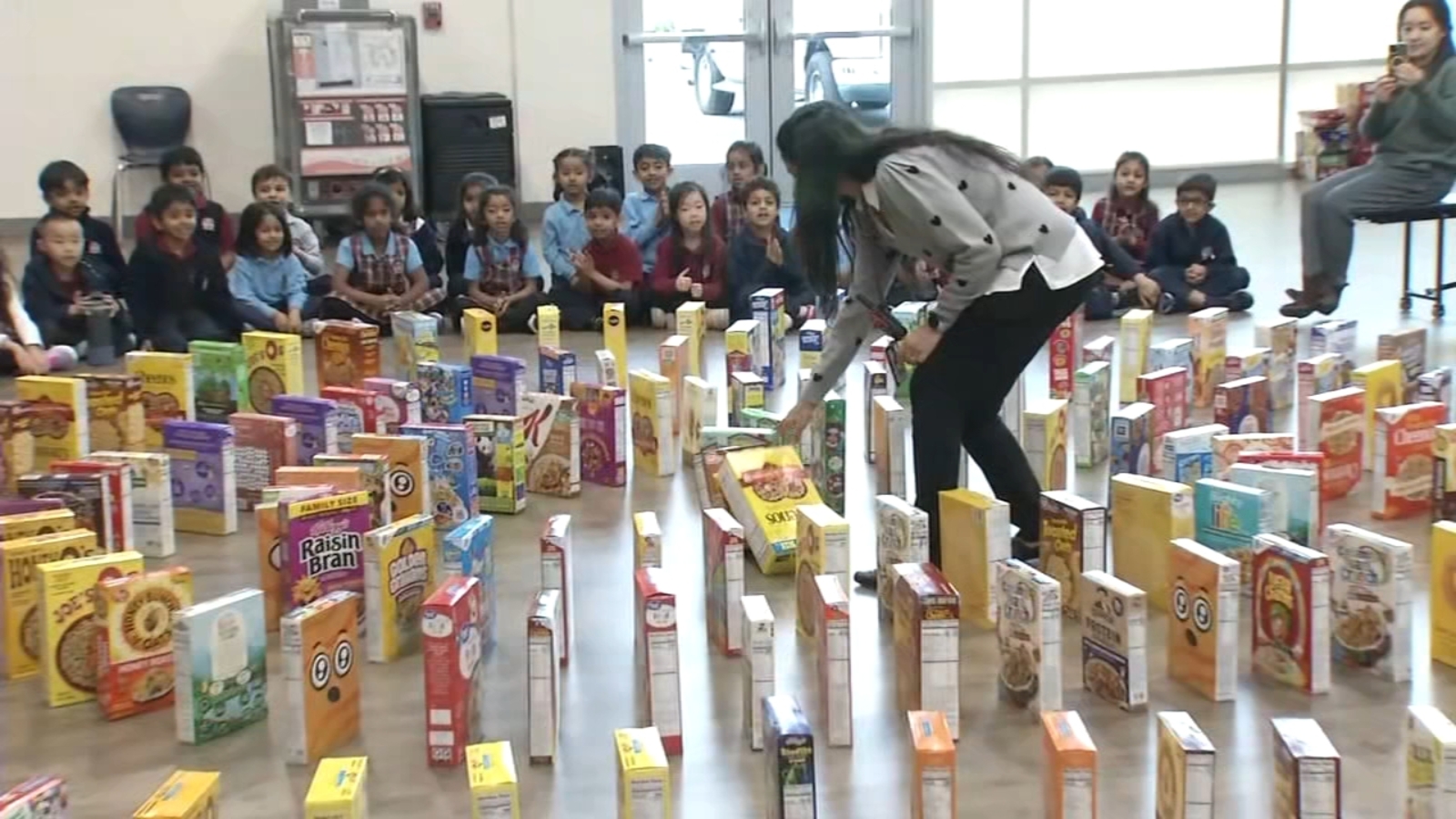 South Bay school holds domino run with hundreds of cereal boxes during donation drive