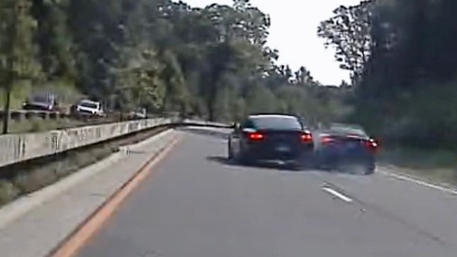 In an image taken from Connecticut State Police police dashcam video, Vince McMahon's car, center left, collides with another car after on July 24, 2025, in Westport, Conn.
