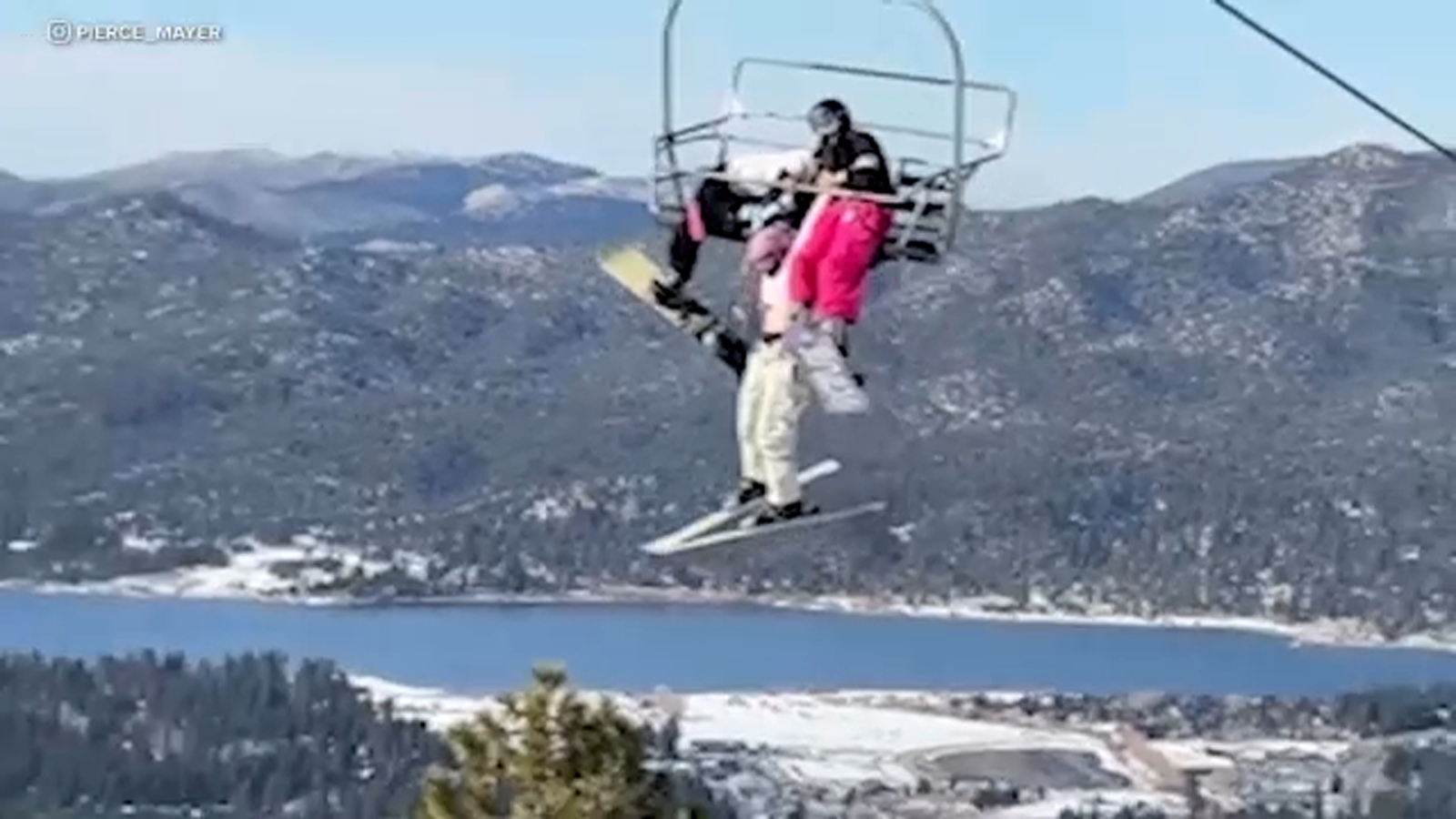 Video shows skier dangling from chairlift at California ski resort