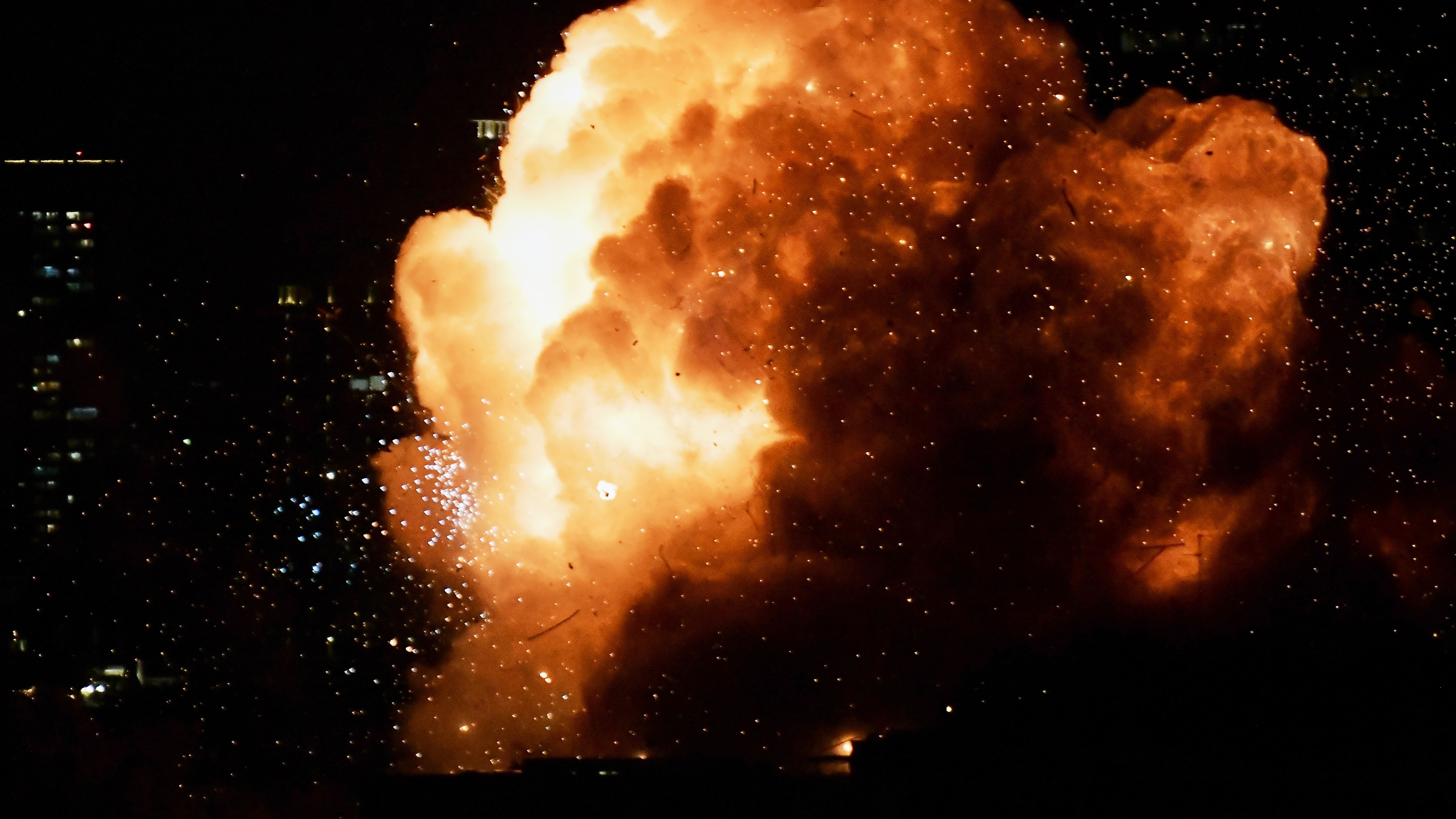 An explosion is seen as an Iranian missile directly hits a building in Tel Aviv, Israel, Saturday, Feb. 28, 2026.